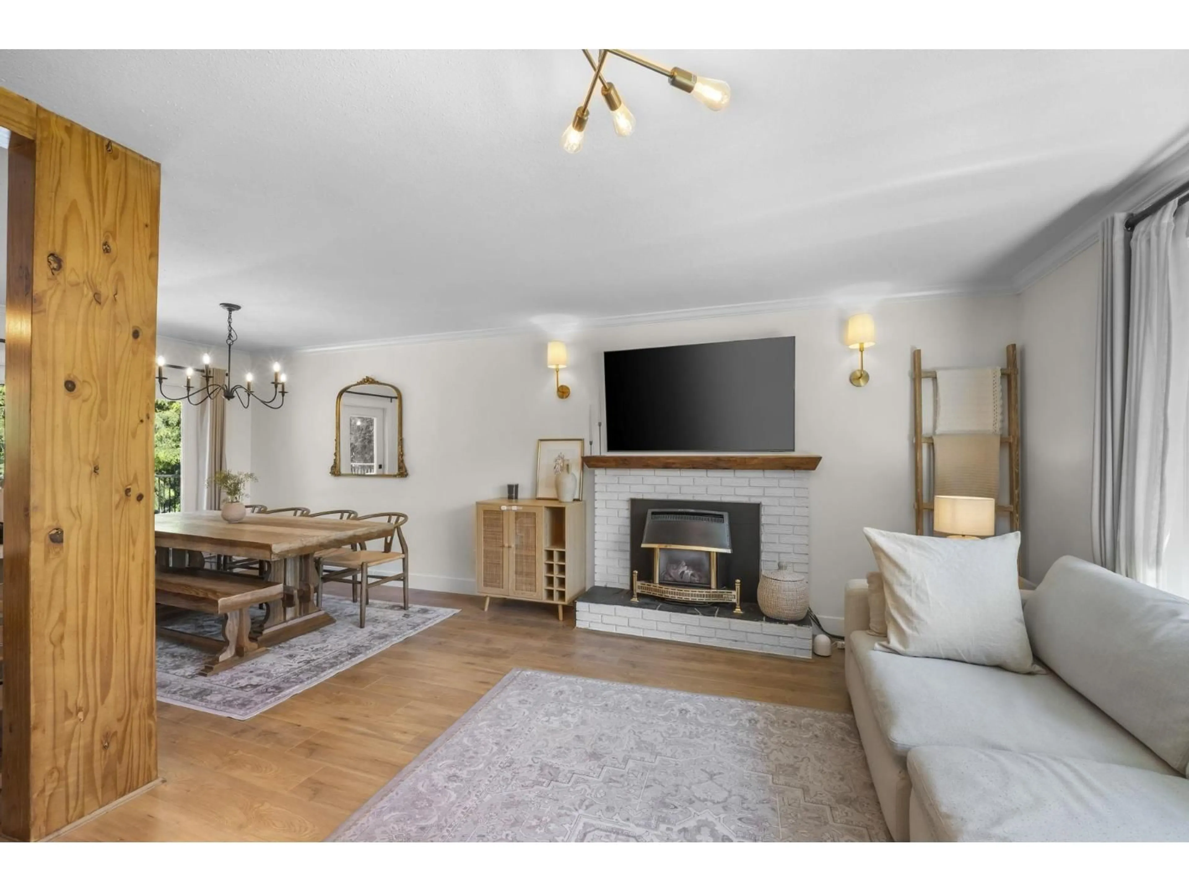 Living room with furniture, wood/laminate floor for 19847 38A AVENUE, Langley British Columbia V3A2V1