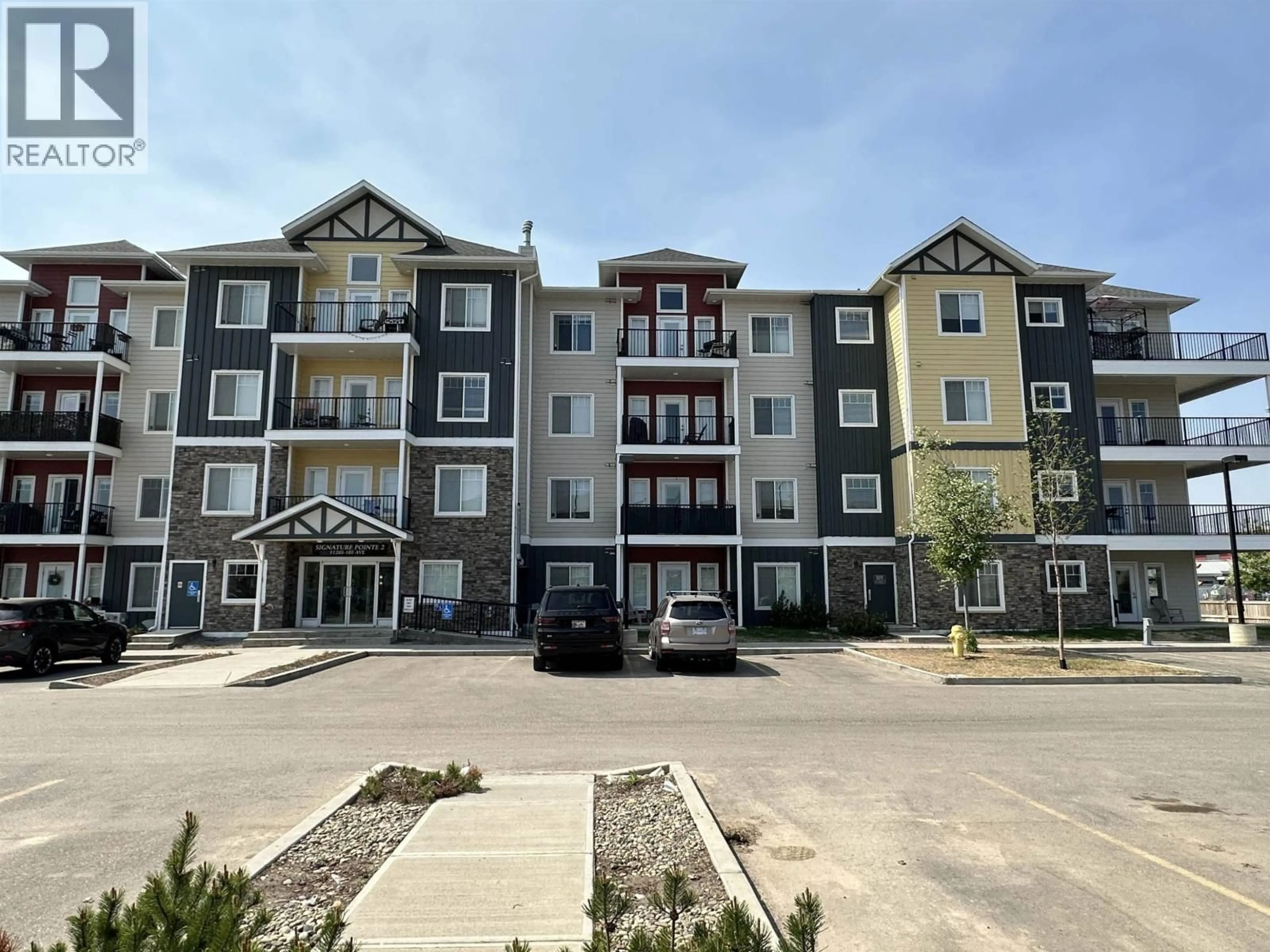 A pic from outside/outdoor area/front of a property/back of a property/a pic from drone, building for 212 - 11205 105 AVENUE, Fort St. John British Columbia V1J0L3