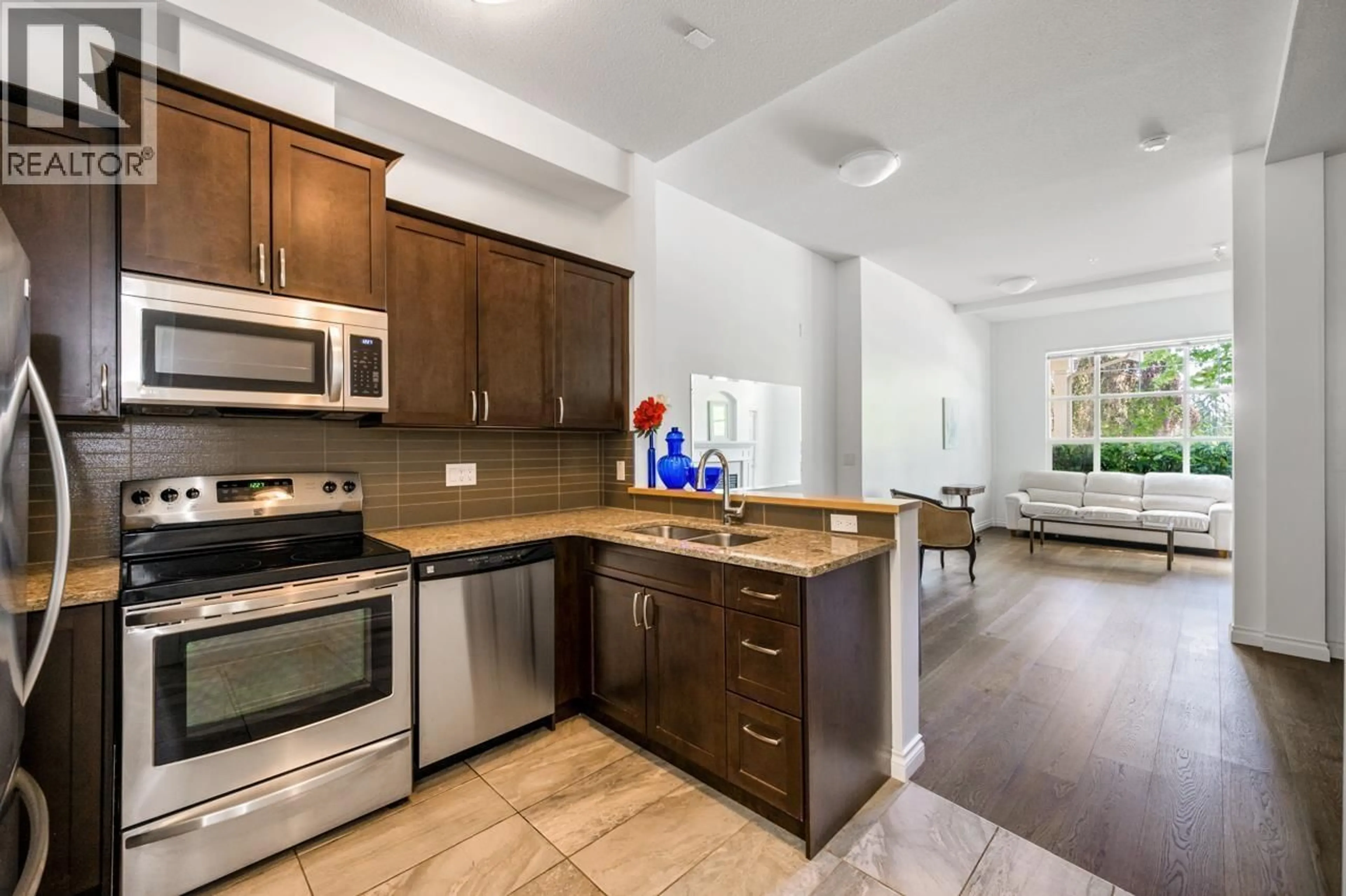 Open concept kitchen, ceramic/tile floor for 113 - 960 LYNN VALLEY ROAD, Vancouver British Columbia V7J3V6