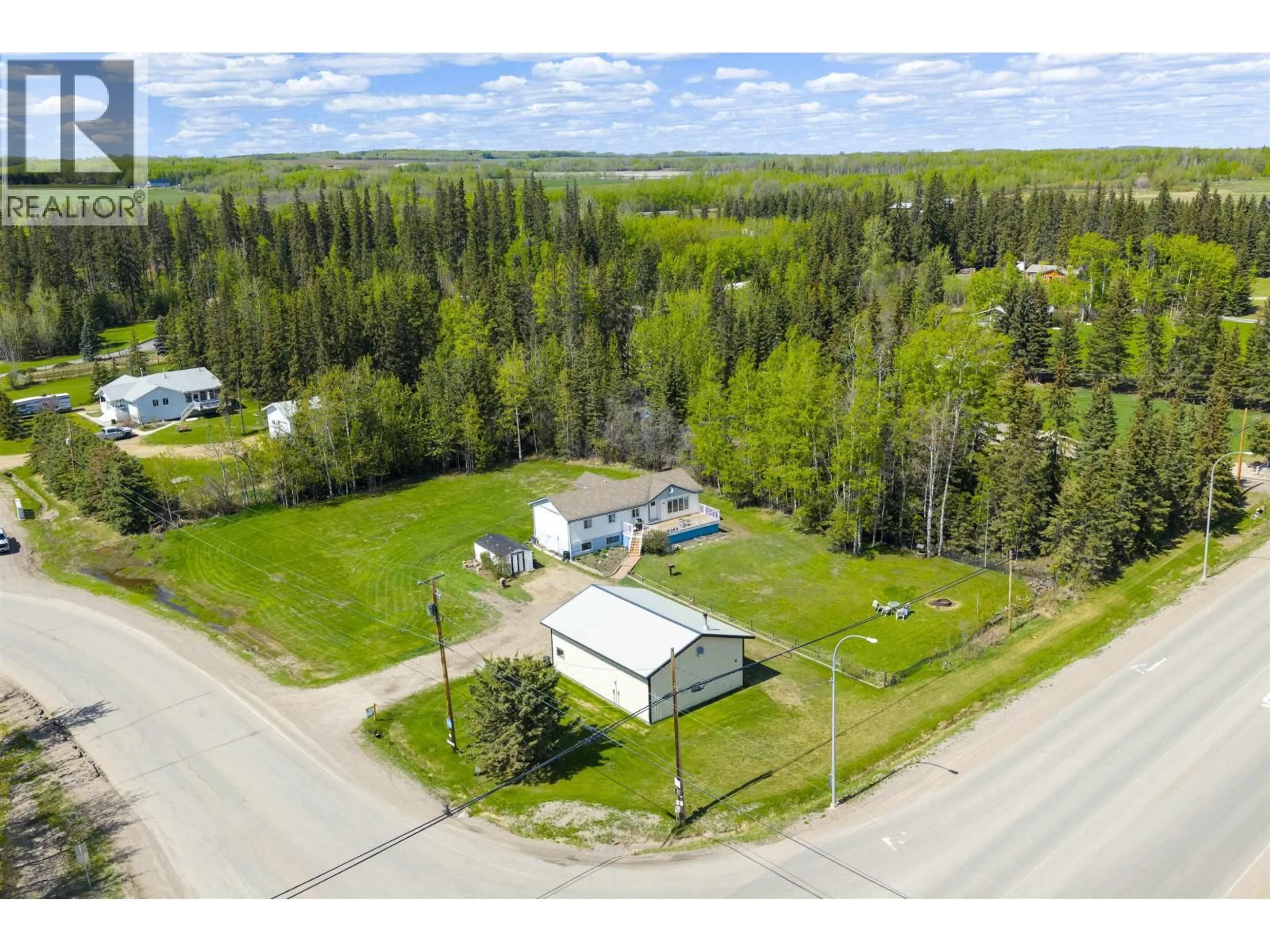 A pic from outside/outdoor area/front of a property/back of a property/a pic from drone, unknown for 13007 BYPASS ROAD, Fort St. John British Columbia V1J8J6