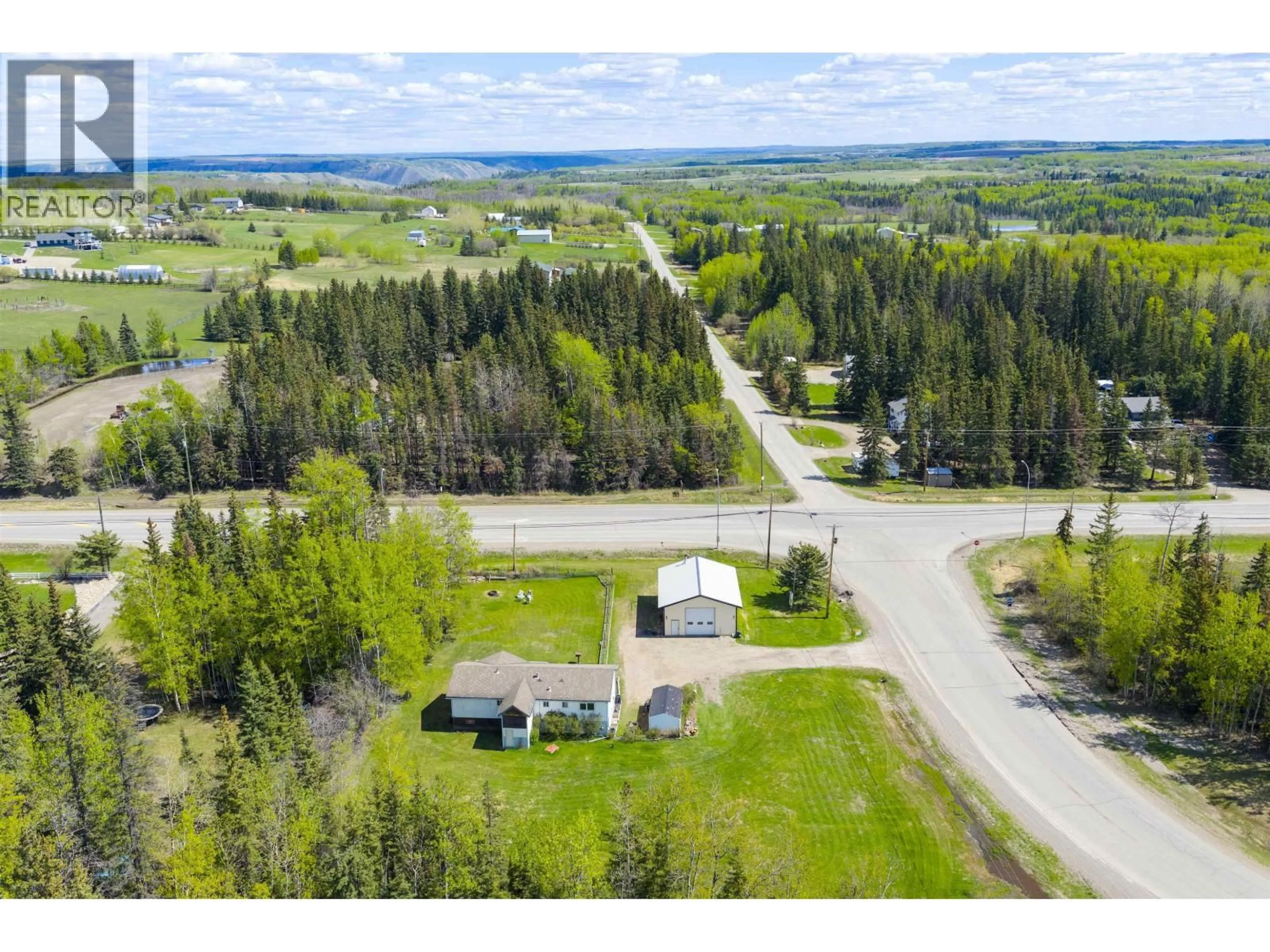 A pic from outside/outdoor area/front of a property/back of a property/a pic from drone, unknown for 13007 BYPASS ROAD, Fort St. John British Columbia V1J8J6
