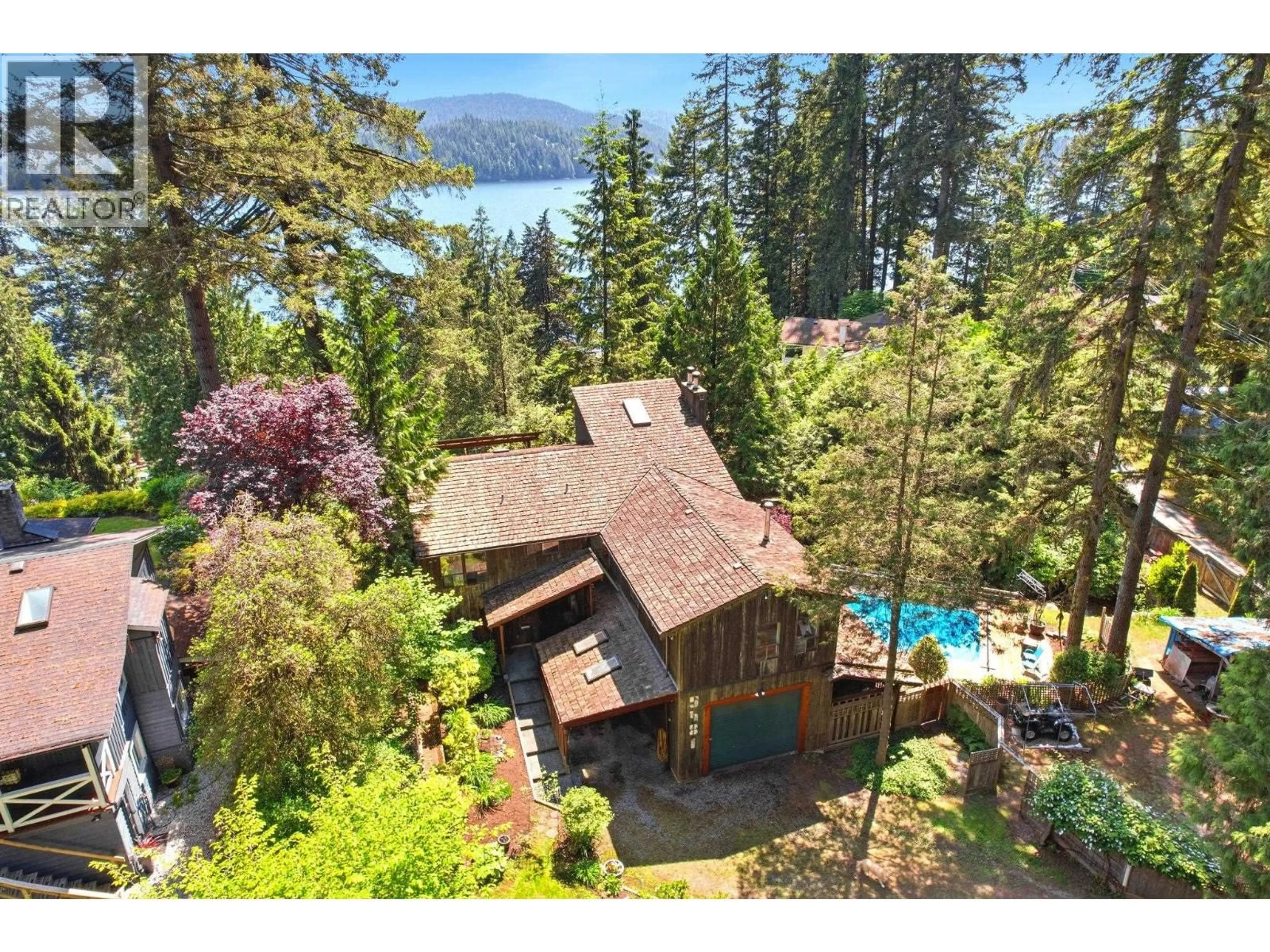 A pic from outside/outdoor area/front of a property/back of a property/a pic from drone, water/lake/river/ocean view for 5481 INDIAN RIVER DRIVE, North Vancouver British Columbia V7G2T7
