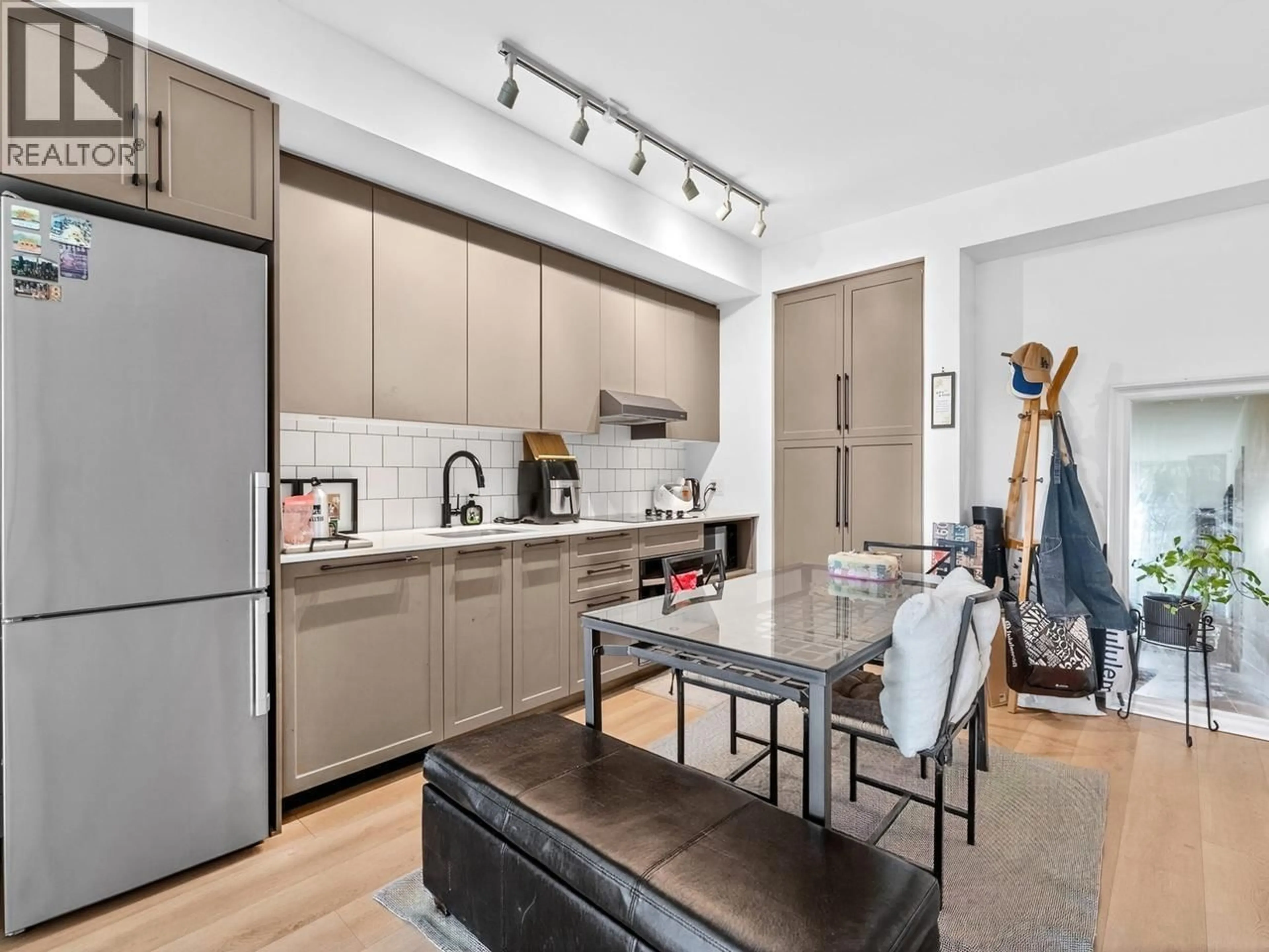 Open concept kitchen, unknown for 202 - 8750 UNIVERSITY CRESCENT, Burnaby British Columbia V5A0G9
