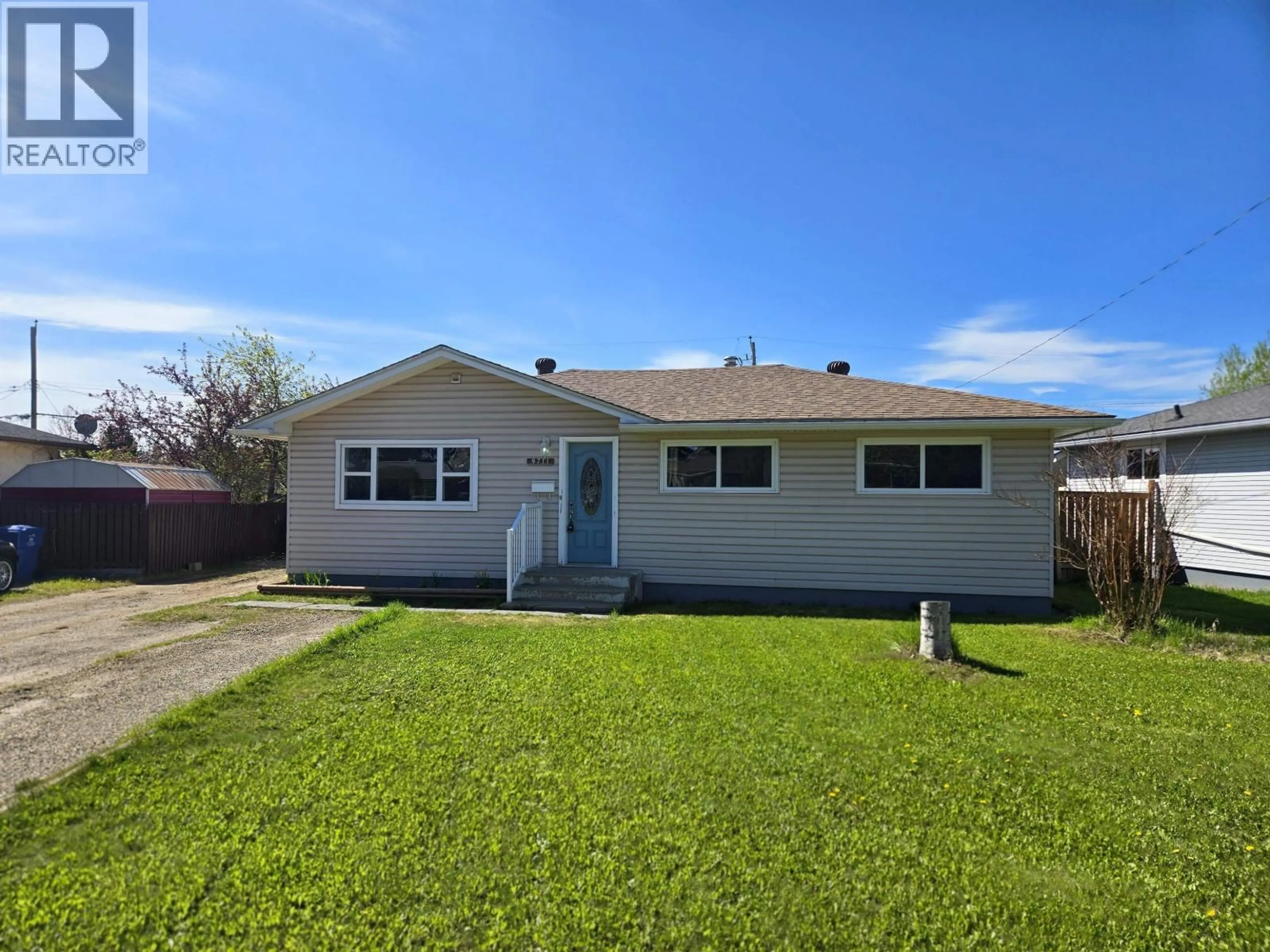 Home with vinyl exterior material, street for 9711 106 AVENUE, Fort St. John British Columbia V1J2N6