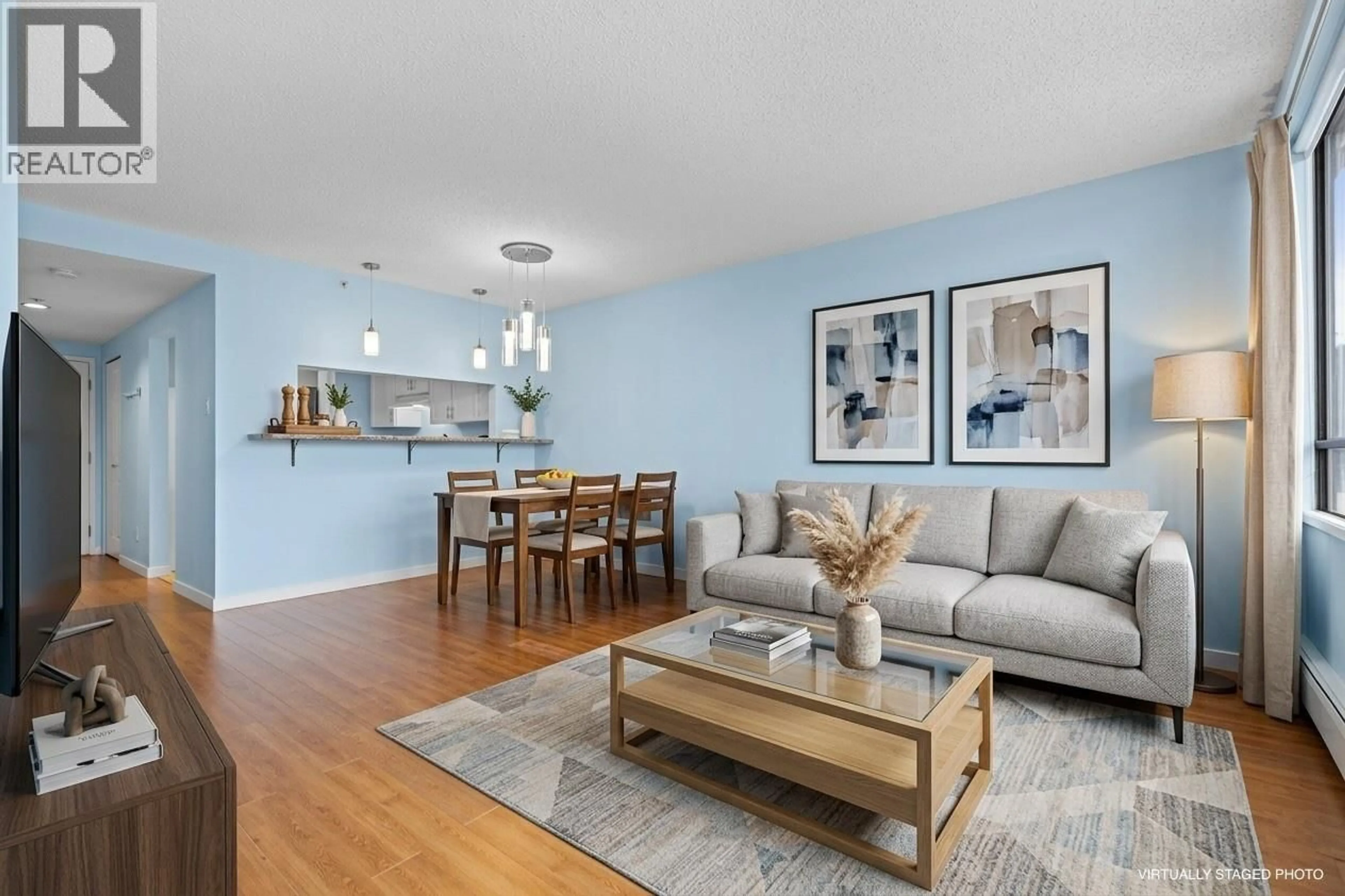 Living room with furniture, wood/laminate floor for 705 - 460 WESTVIEW STREET, Coquitlam British Columbia V3K6C9