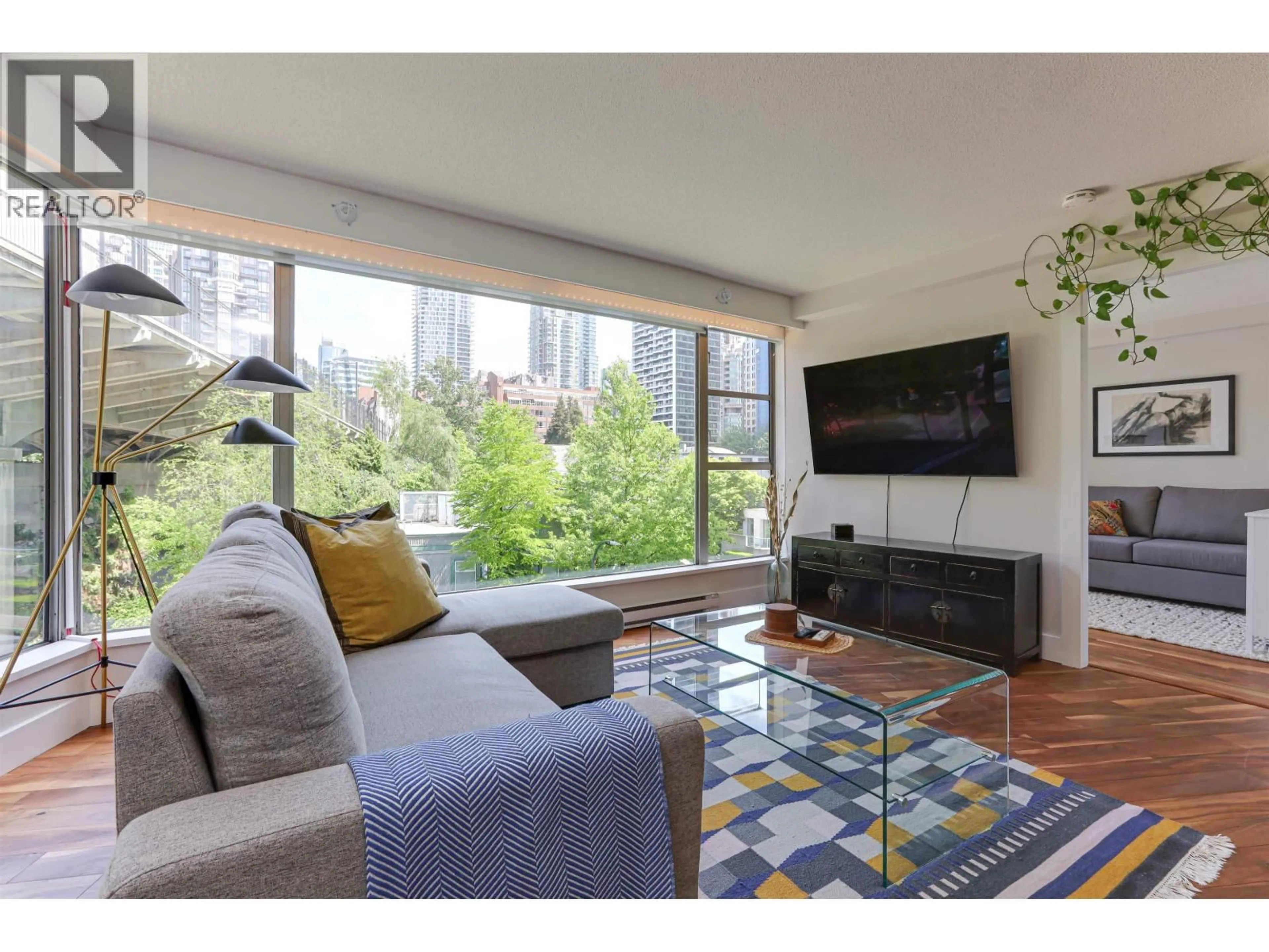 Living room with furniture, wood/laminate floor for 505 - 1006 BEACH AVENUE, Vancouver British Columbia V6E1T7