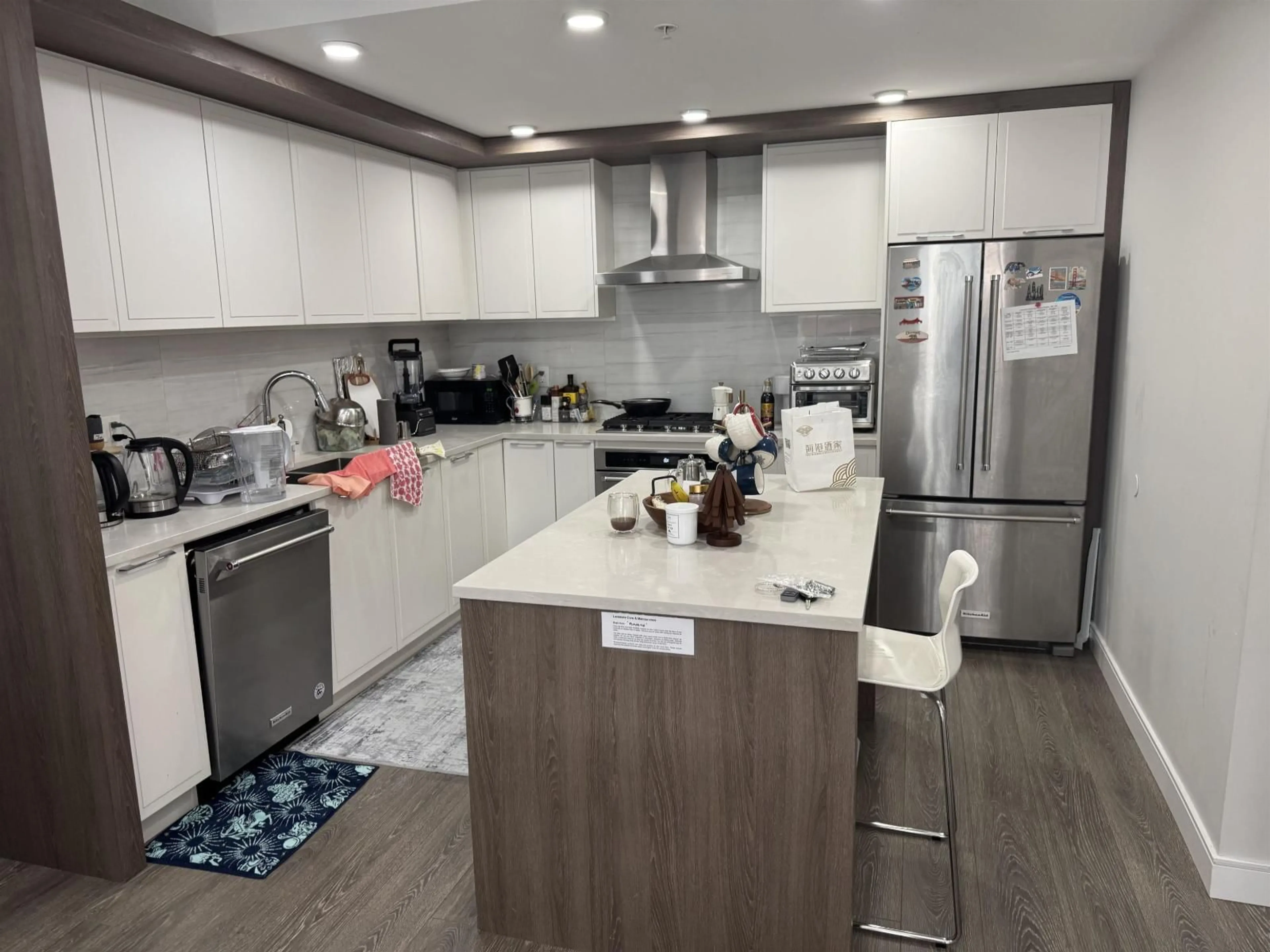 Open concept kitchen, wood/laminate floor for 218 - 11507 84 AVENUE, Delta British Columbia V4C0E5