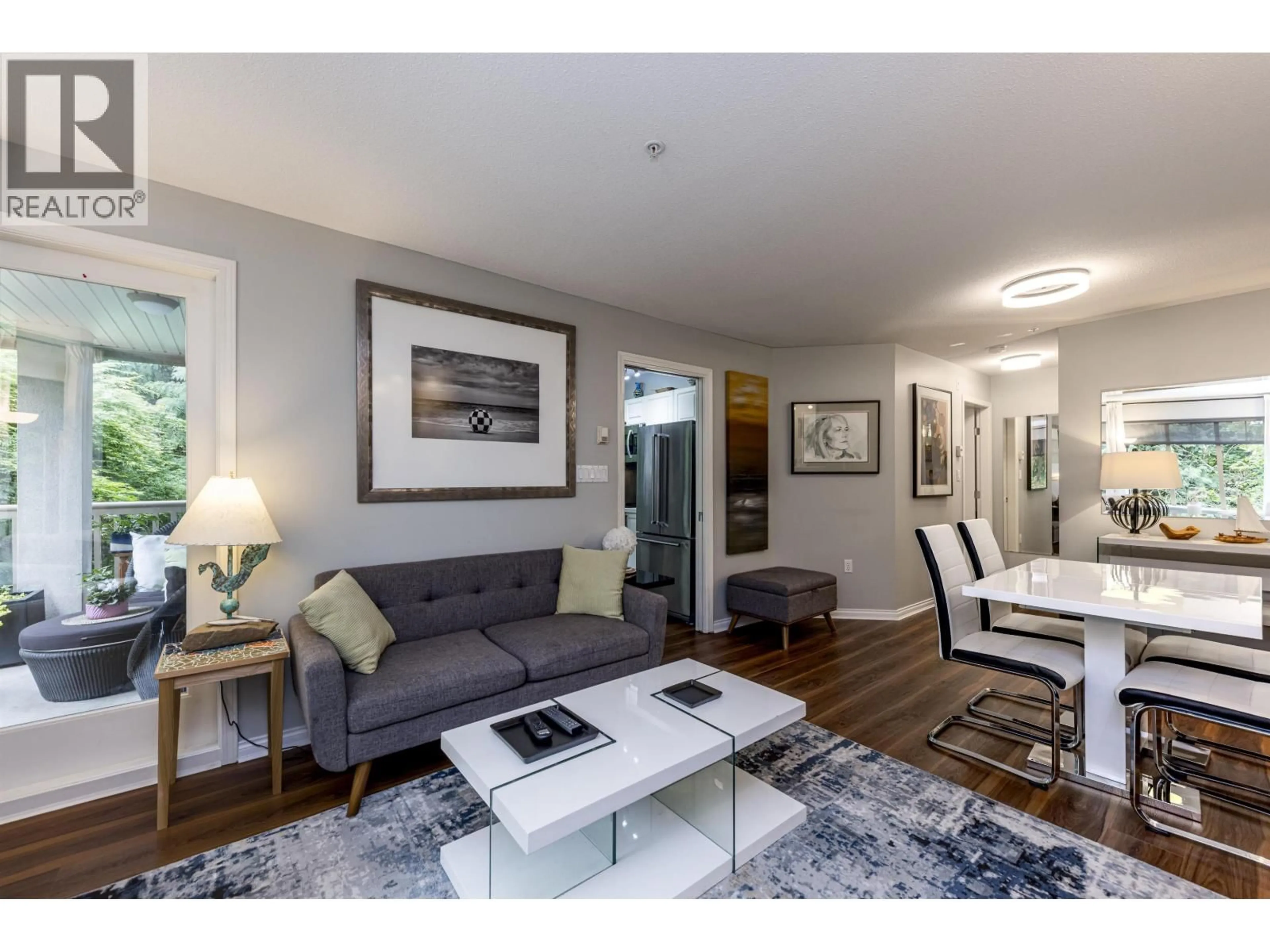 Living room with furniture, wood/laminate floor for 412 - 2059 CHESTERFIELD AVENUE, North Vancouver British Columbia V7M2P4