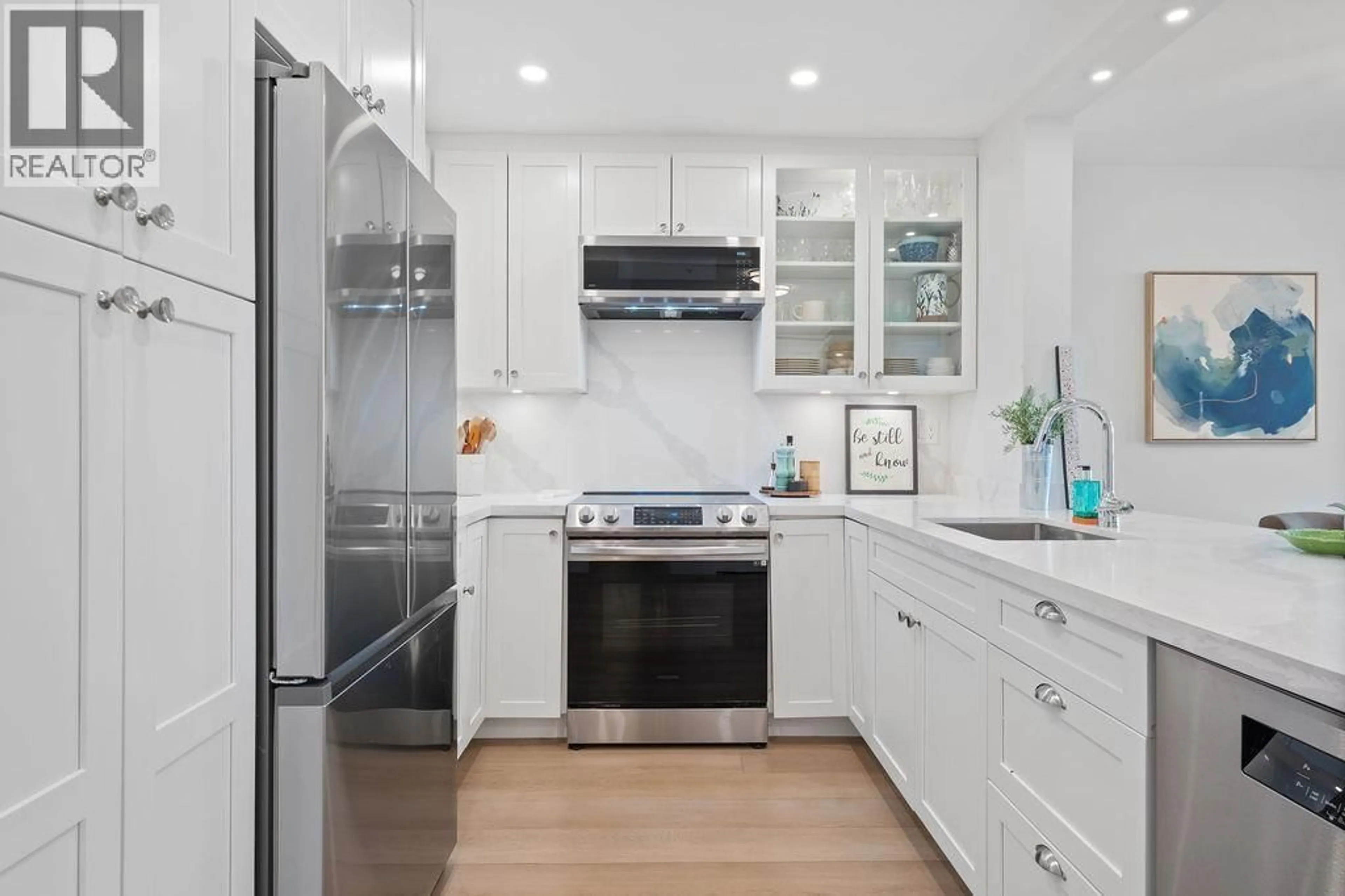 Contemporary kitchen, ceramic/tile floor for 404 - 12639 NO. 2 ROAD, Richmond British Columbia V7E6N6