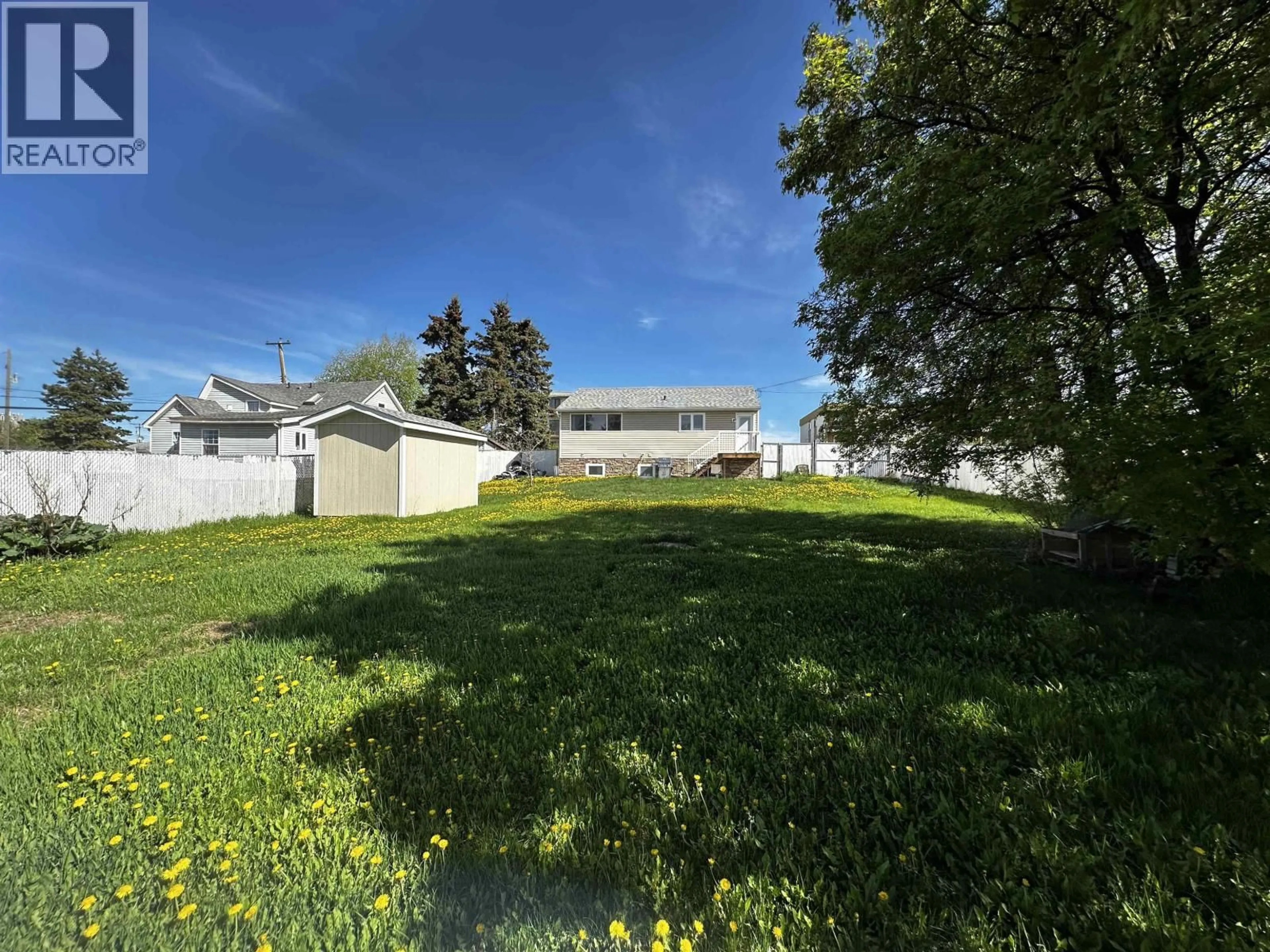 A pic from outside/outdoor area/front of a property/back of a property/a pic from drone, street for 9519 99 AVENUE, Fort St. John British Columbia V1J1T5