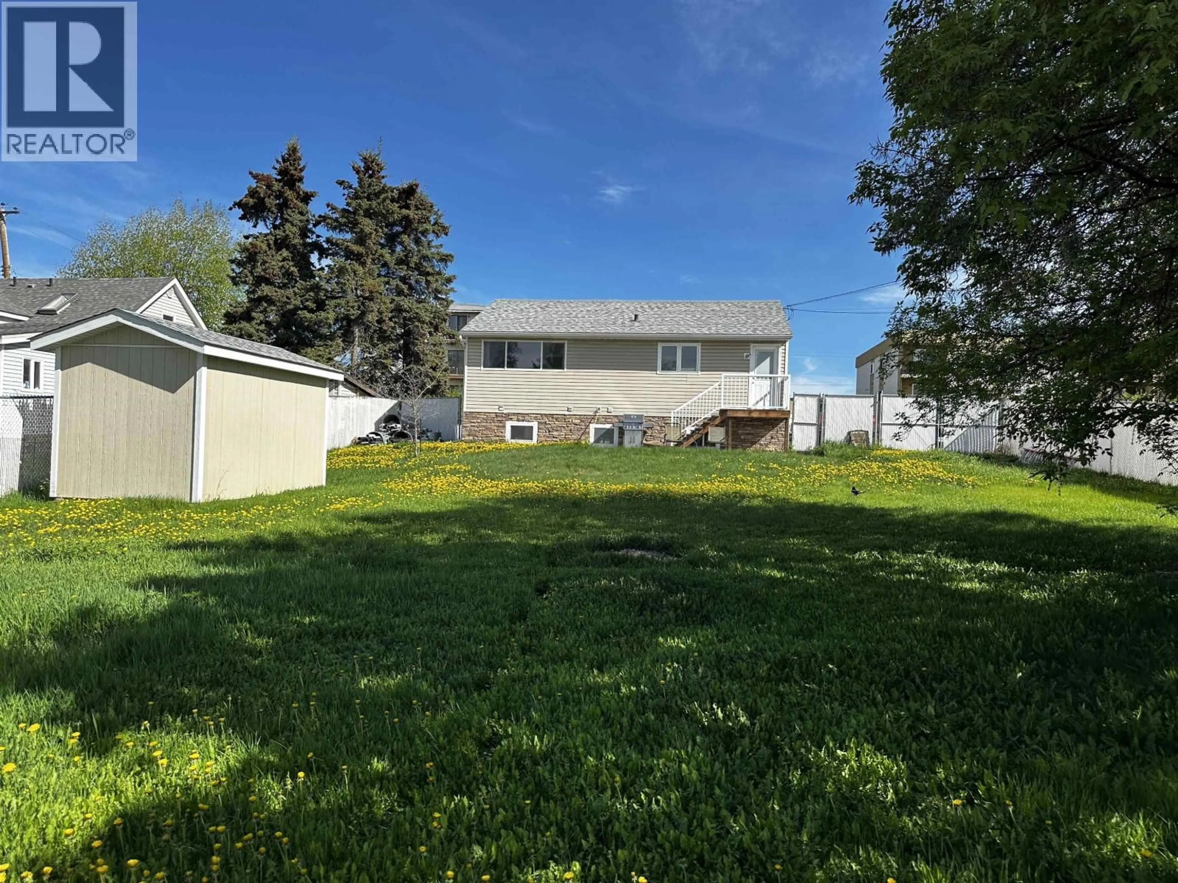 A pic from outside/outdoor area/front of a property/back of a property/a pic from drone, unknown for 9519 99 AVENUE, Fort St. John British Columbia V1J1T5