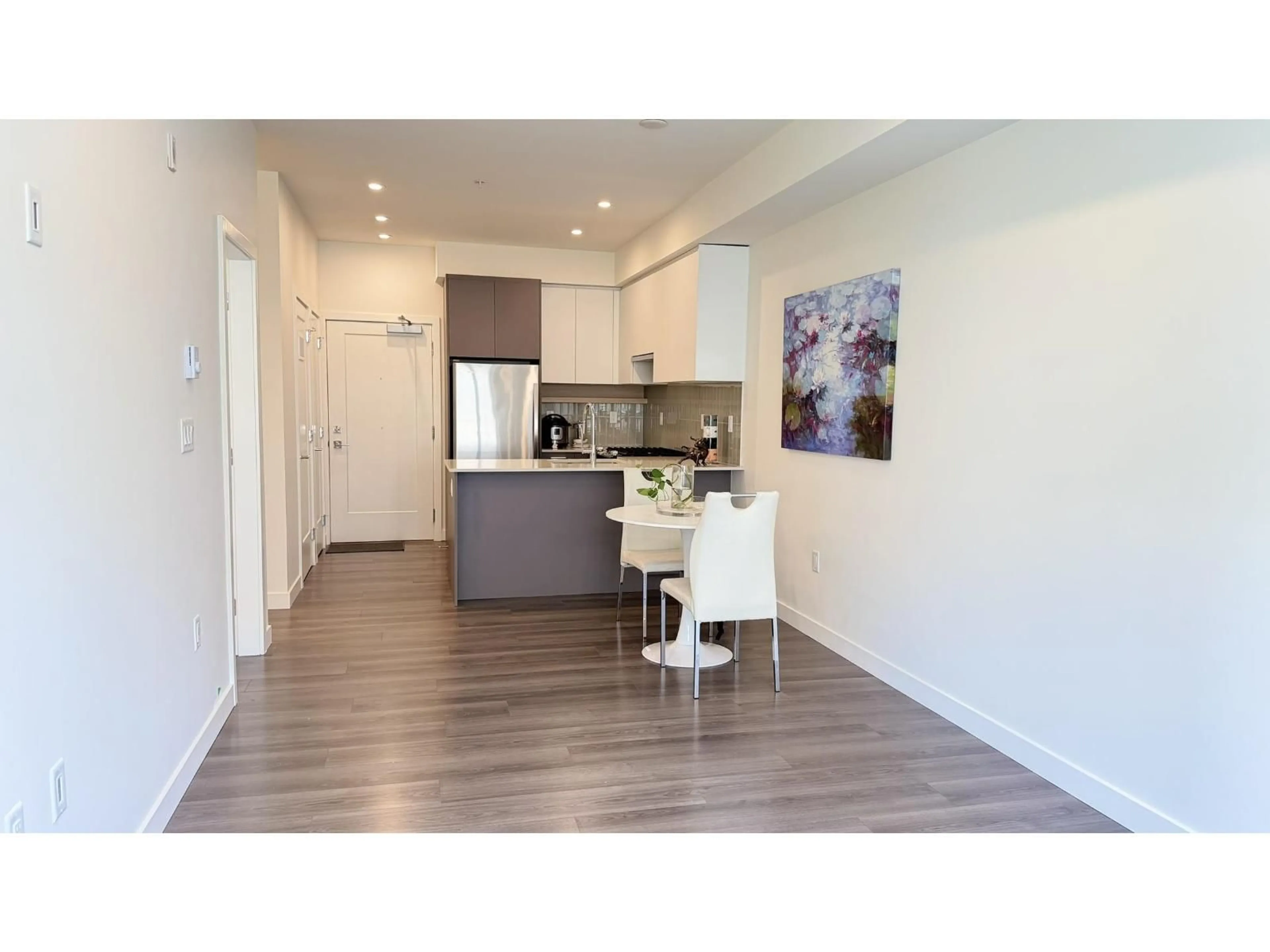 Open concept kitchen, wood/laminate floor for 204 - 13777 75A AVENUE, Surrey British Columbia V3W3W4