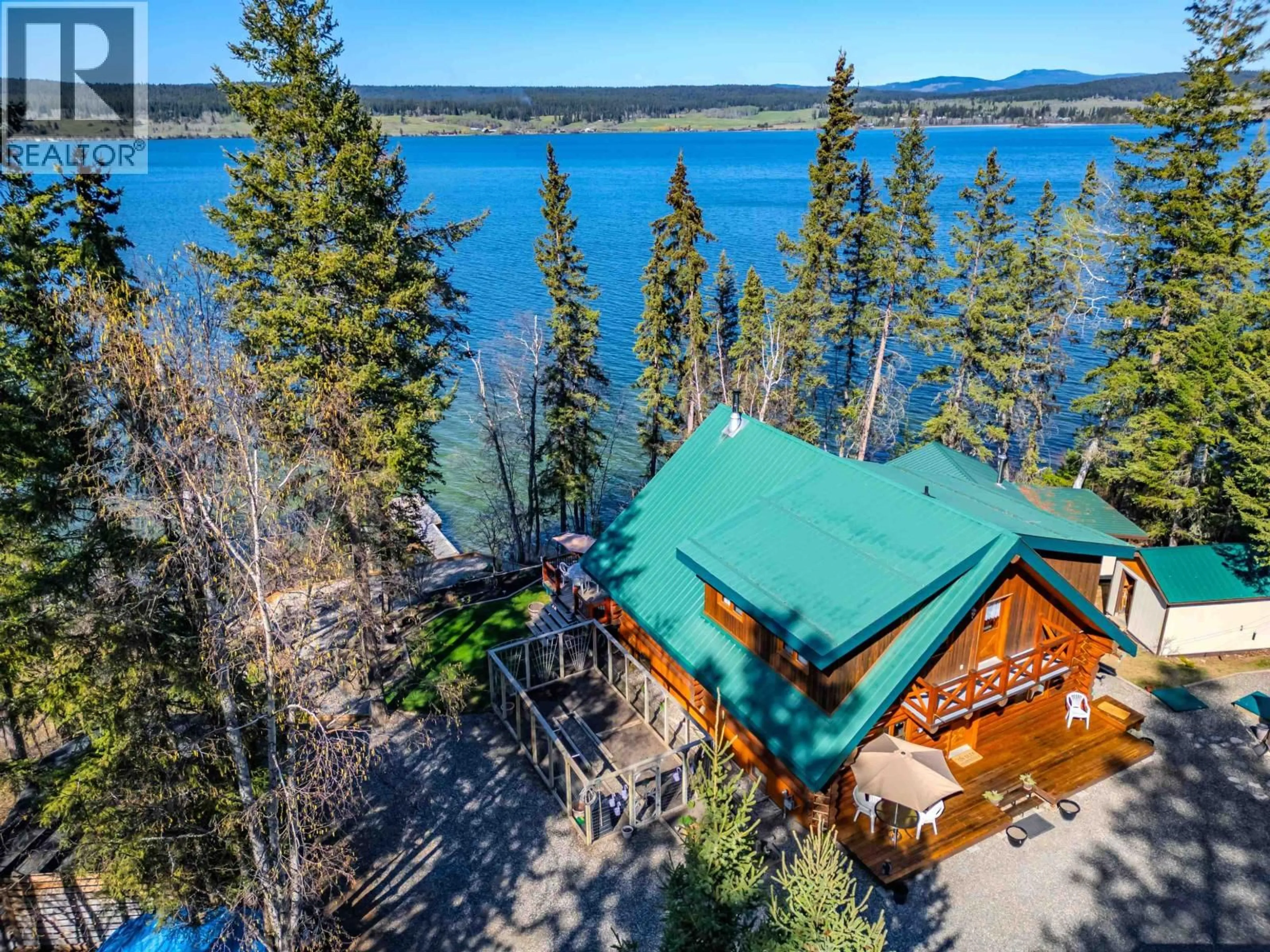 A pic from outside/outdoor area/front of a property/back of a property/a pic from drone, water/lake/river/ocean view for 4677 CAVERLY ROAD, Lac La Hache British Columbia V0K1T0