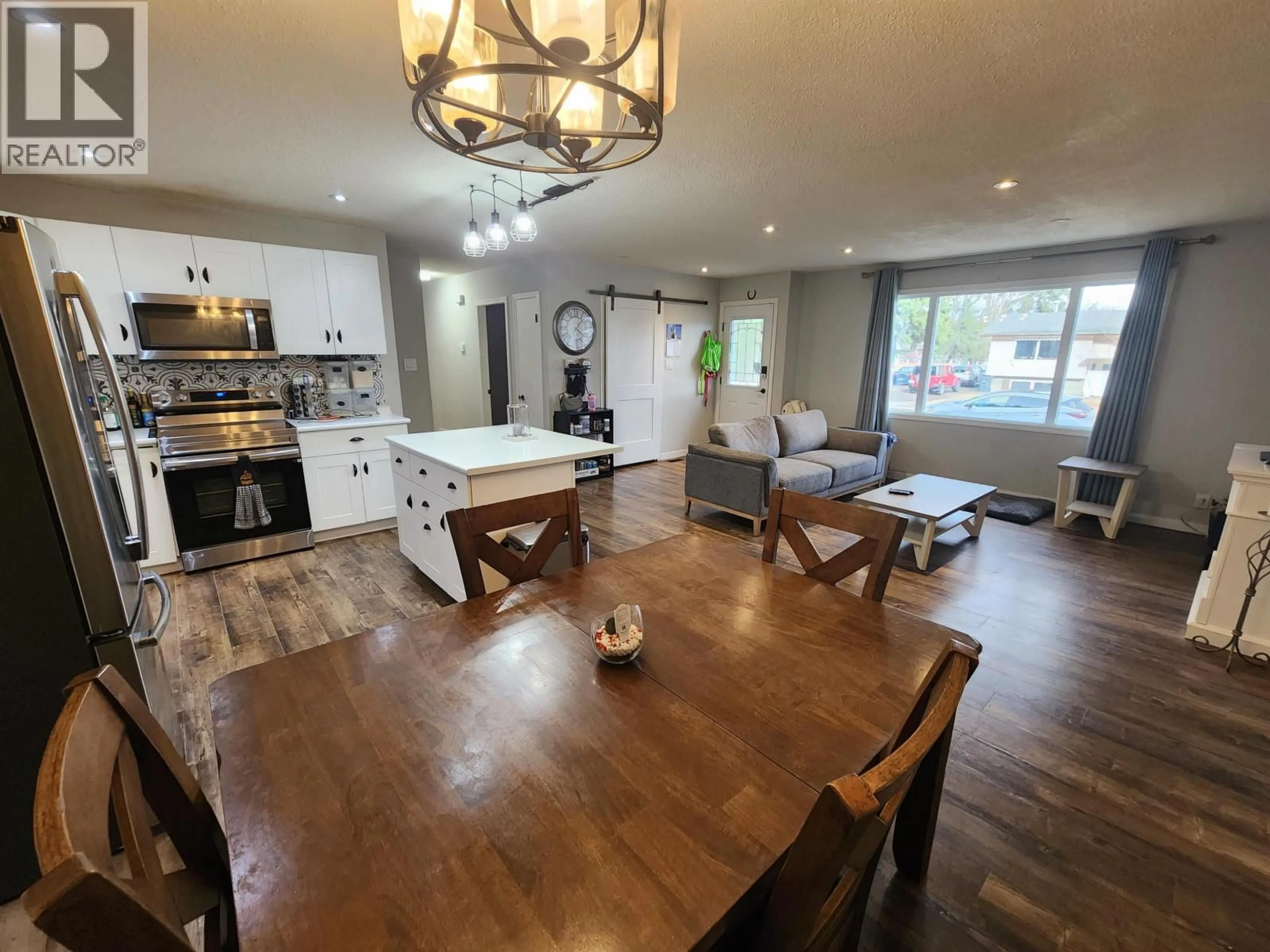 Open concept kitchen, wood/laminate floor for 5801 BROCK DRIVE, Prince George British Columbia V2N2E3