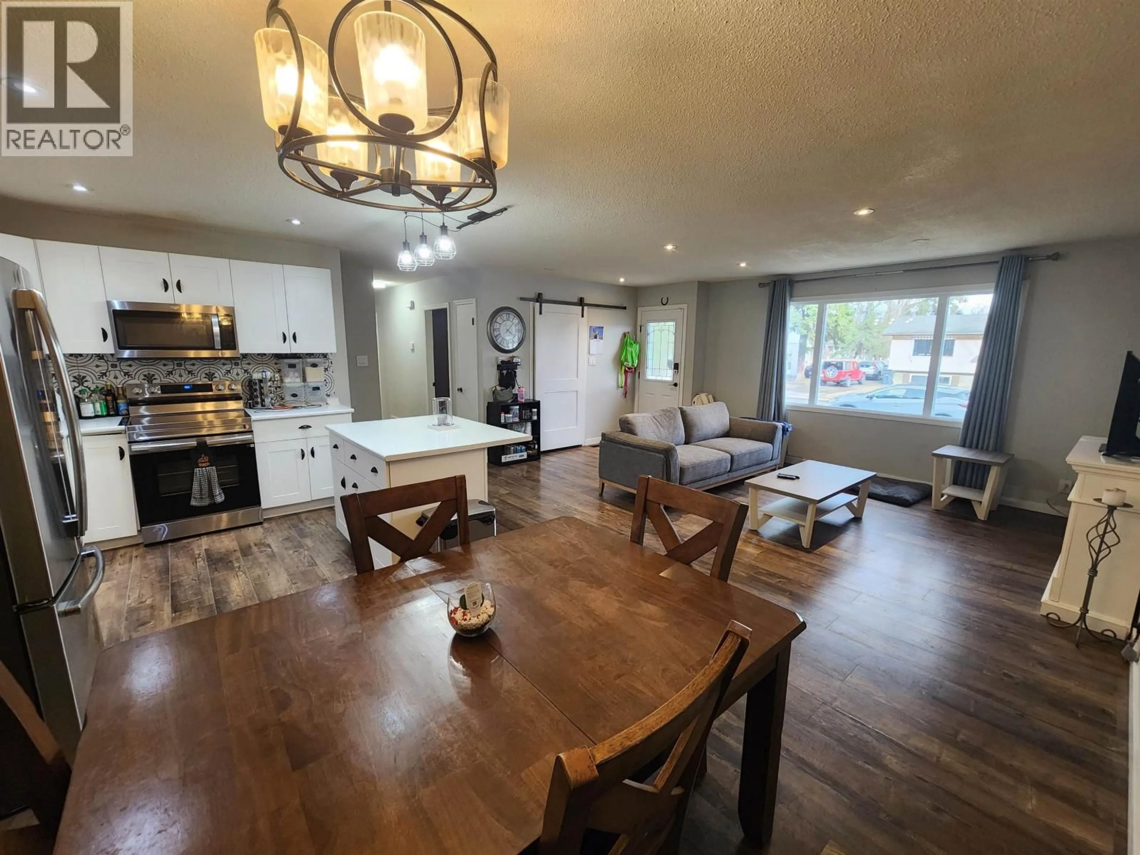 Open concept kitchen, wood/laminate floor for 5801 BROCK DRIVE, Prince George British Columbia V2N2E3