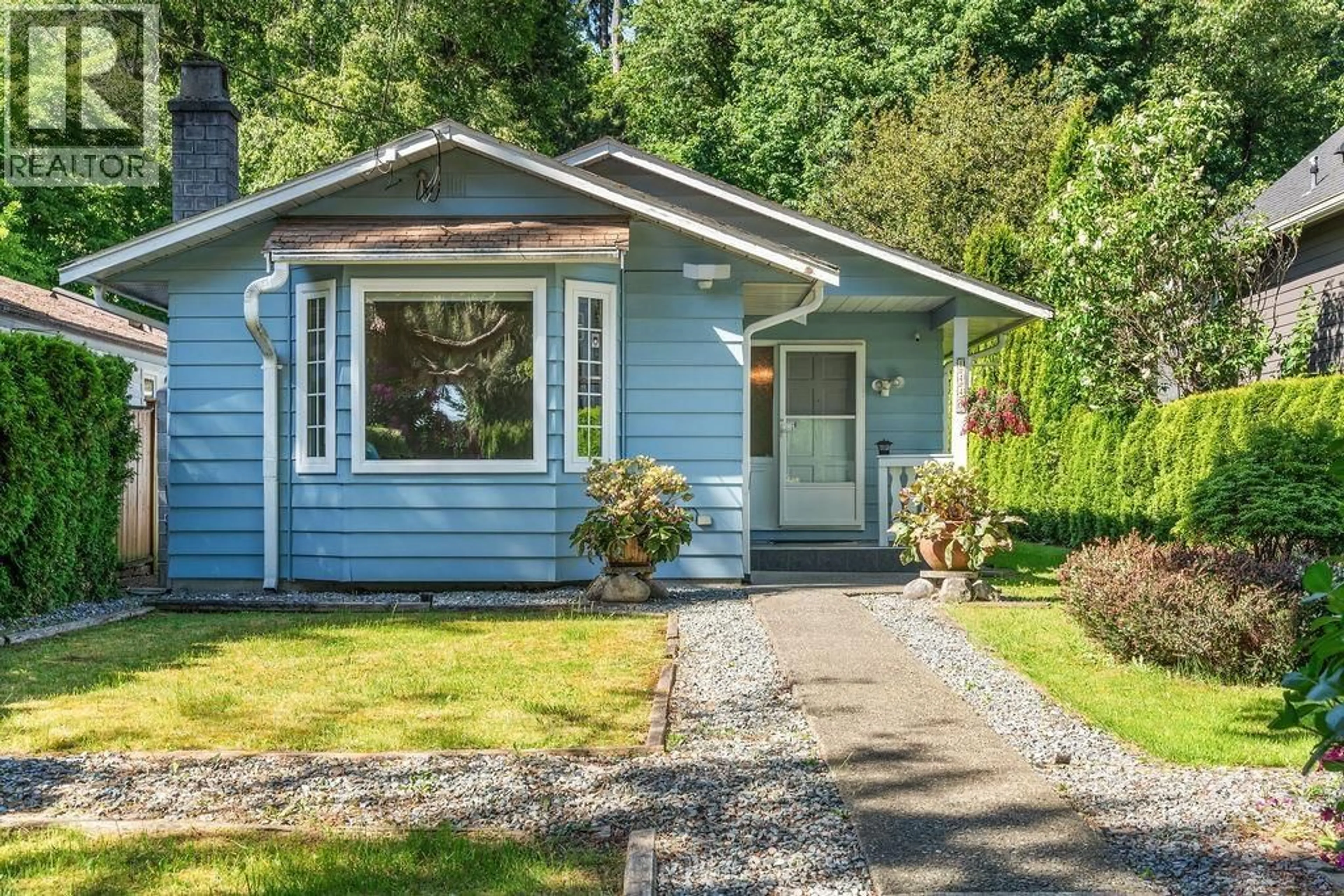 Home with vinyl exterior material, street for 1440 HOPE ROAD, North Vancouver British Columbia V7P1W8