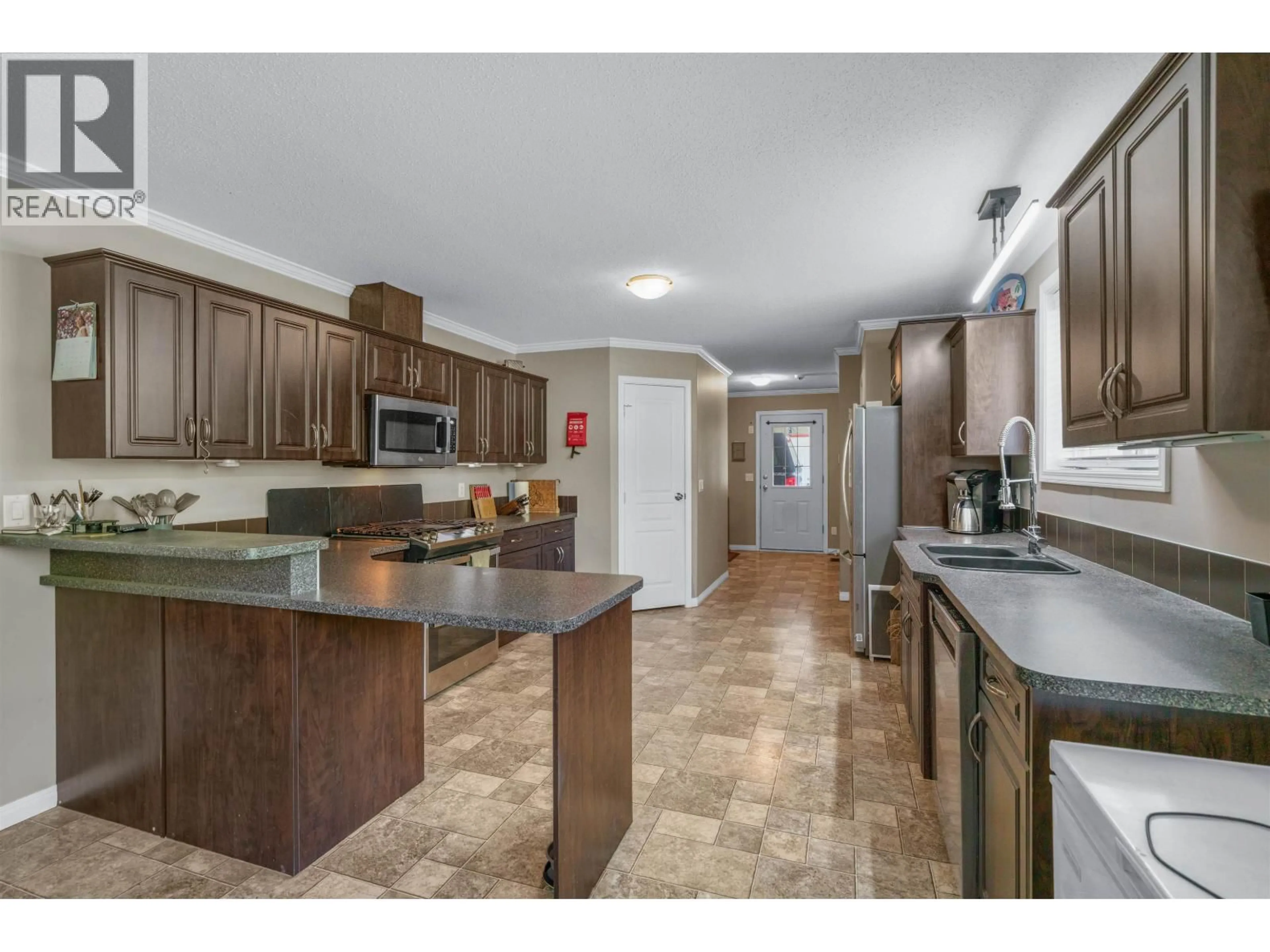 Open concept kitchen, ceramic/tile floor for 385 COLGROVE ROAD, Hixon British Columbia V0K1S0