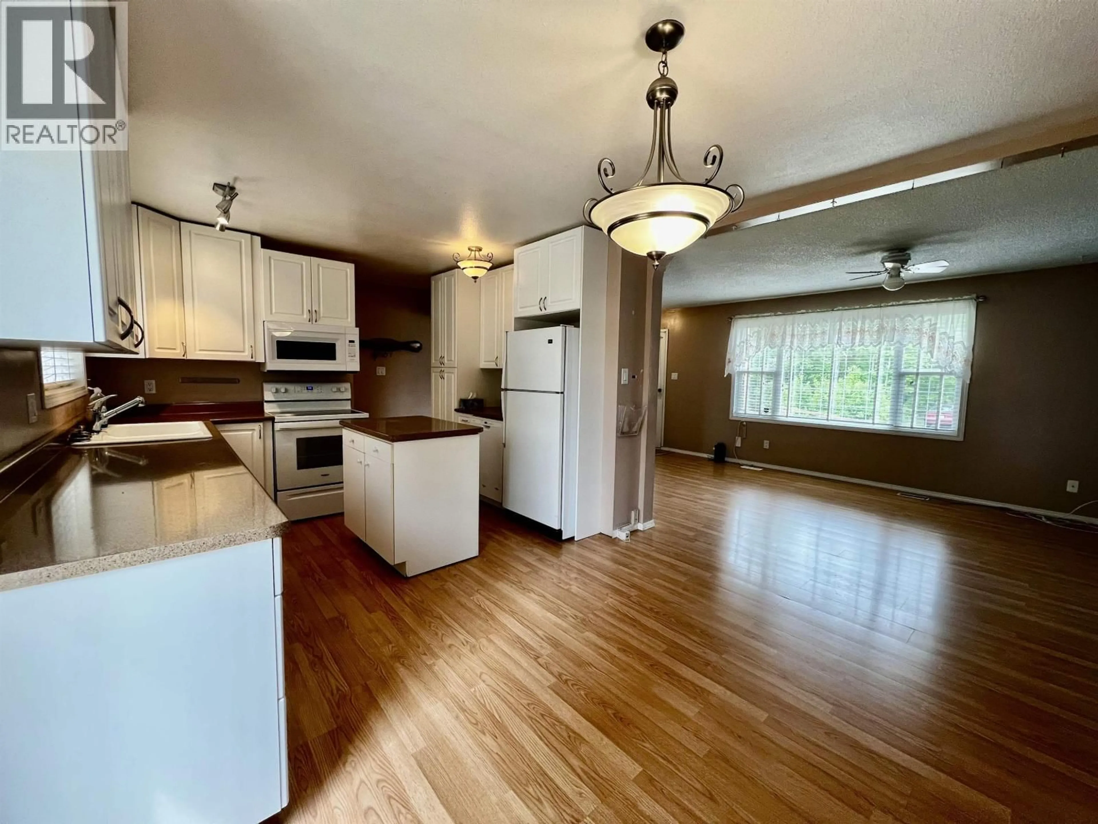 Open concept kitchen, wood/laminate floor for 69 FRANCOIS DRIVE, Fraser Lake British Columbia V0J1S0