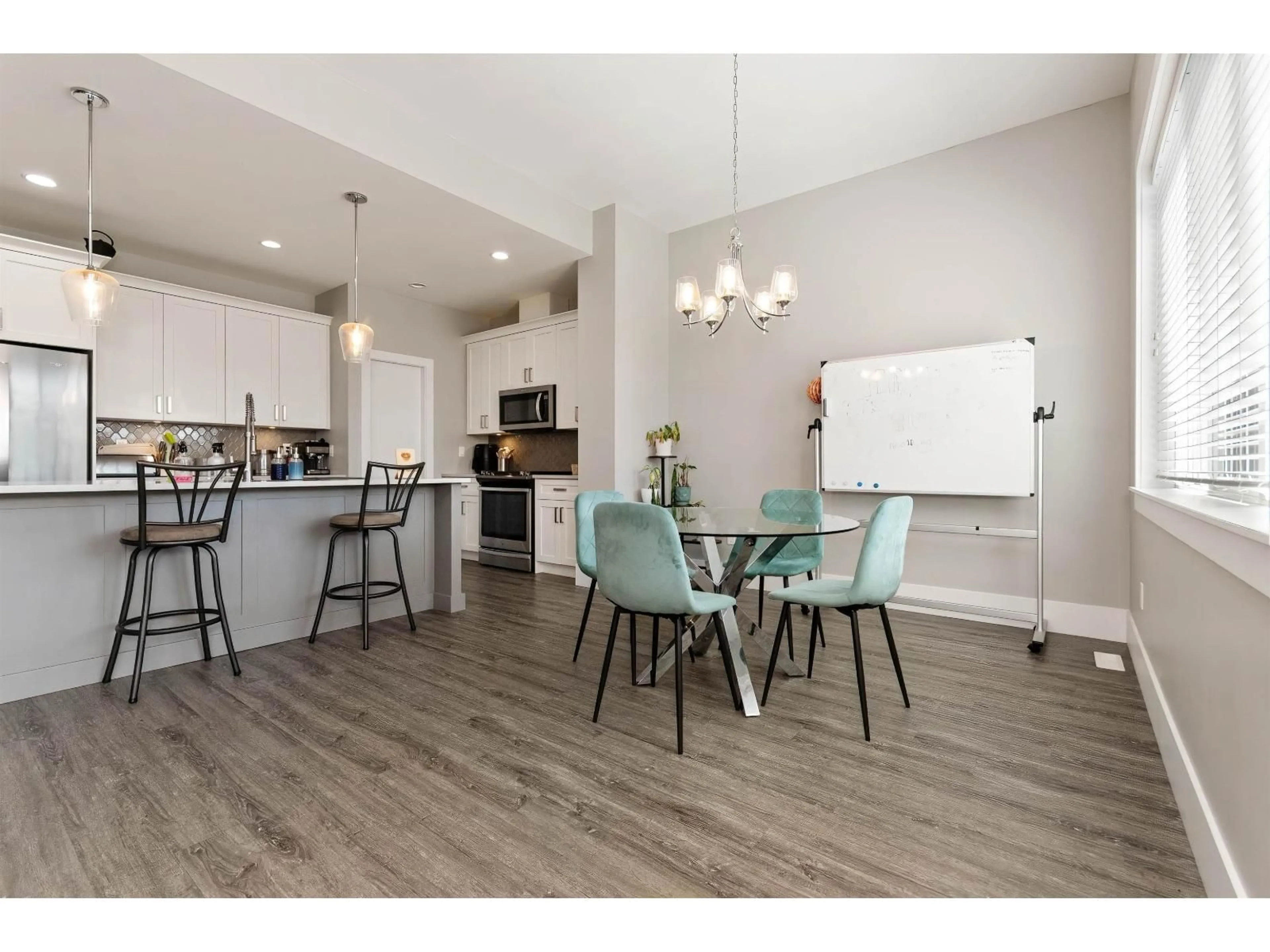 Open concept kitchen, wood/laminate floor for 6567 FERN STREET, Chilliwack British Columbia V2R2Z7