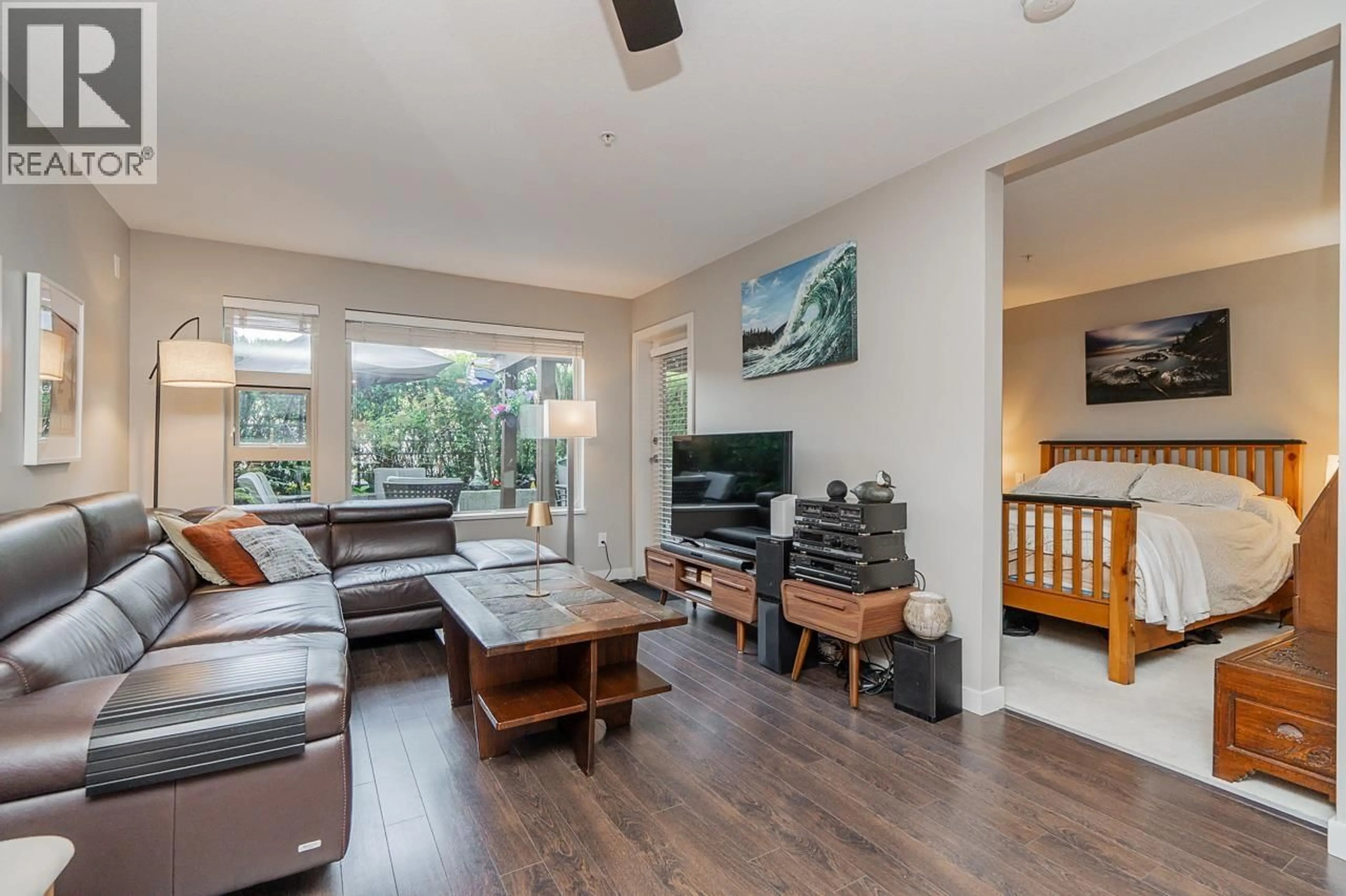 Living room with furniture, wood/laminate floor for 207 - 1677 LLOYD AVENUE, North Vancouver British Columbia V7P0B1