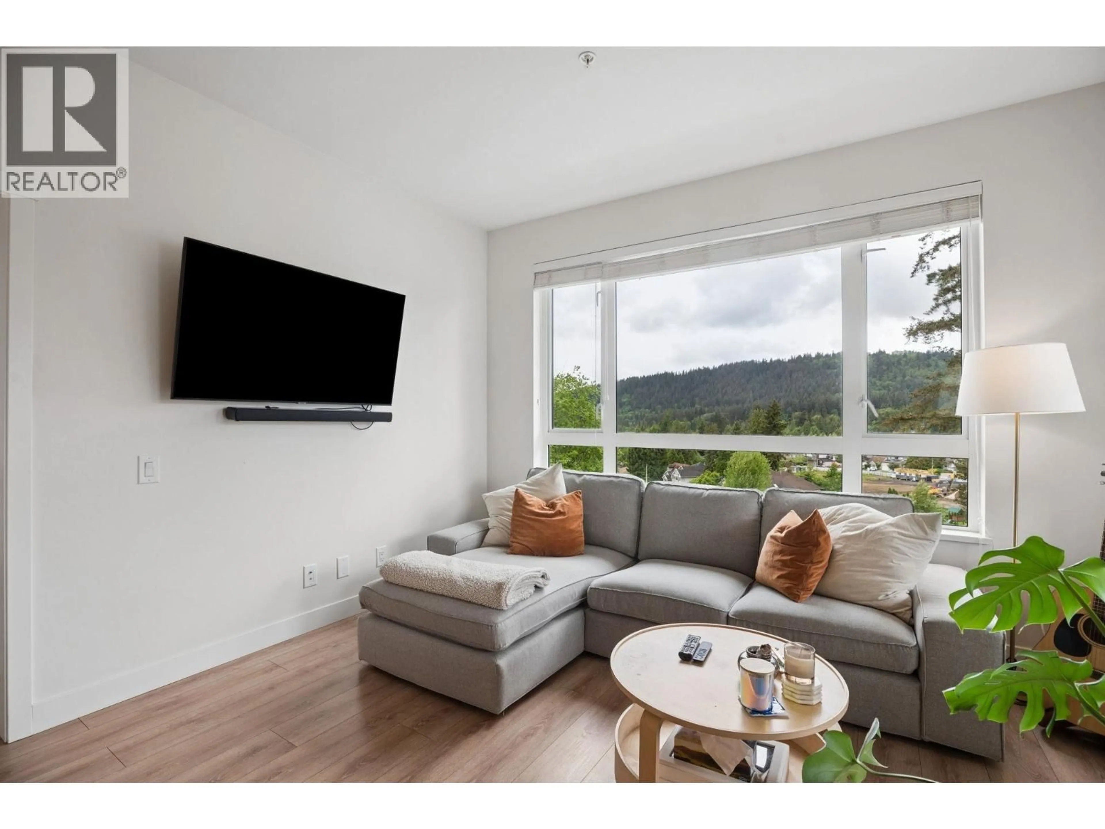 Living room with furniture, wood/laminate floor for 612 - 721 ANSKAR COURT, Coquitlam British Columbia V3J0L4