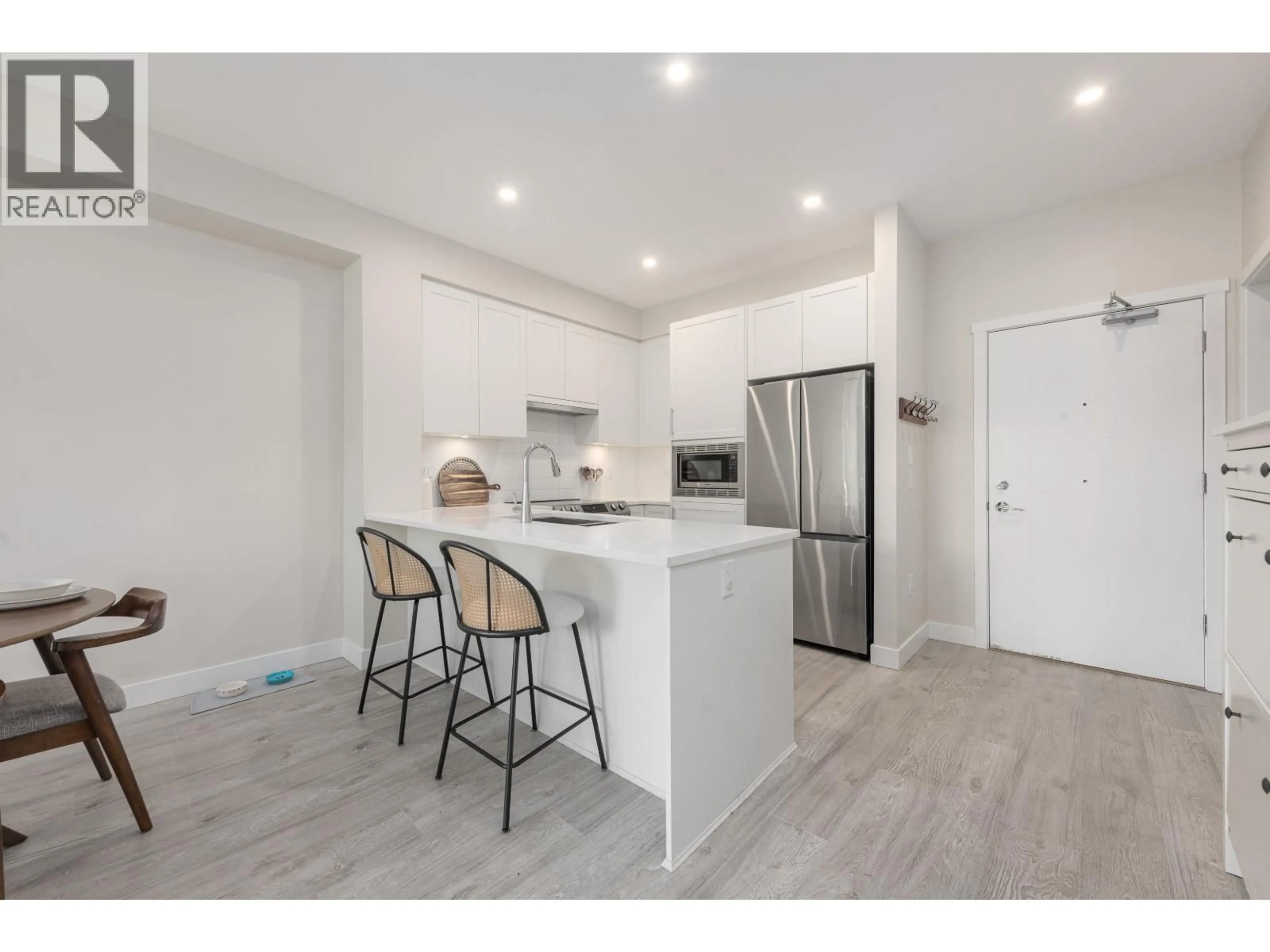 Open concept kitchen, wood/laminate floor for 410 - 2160 GRANT AVENUE, Port Coquitlam British Columbia V3B0T3
