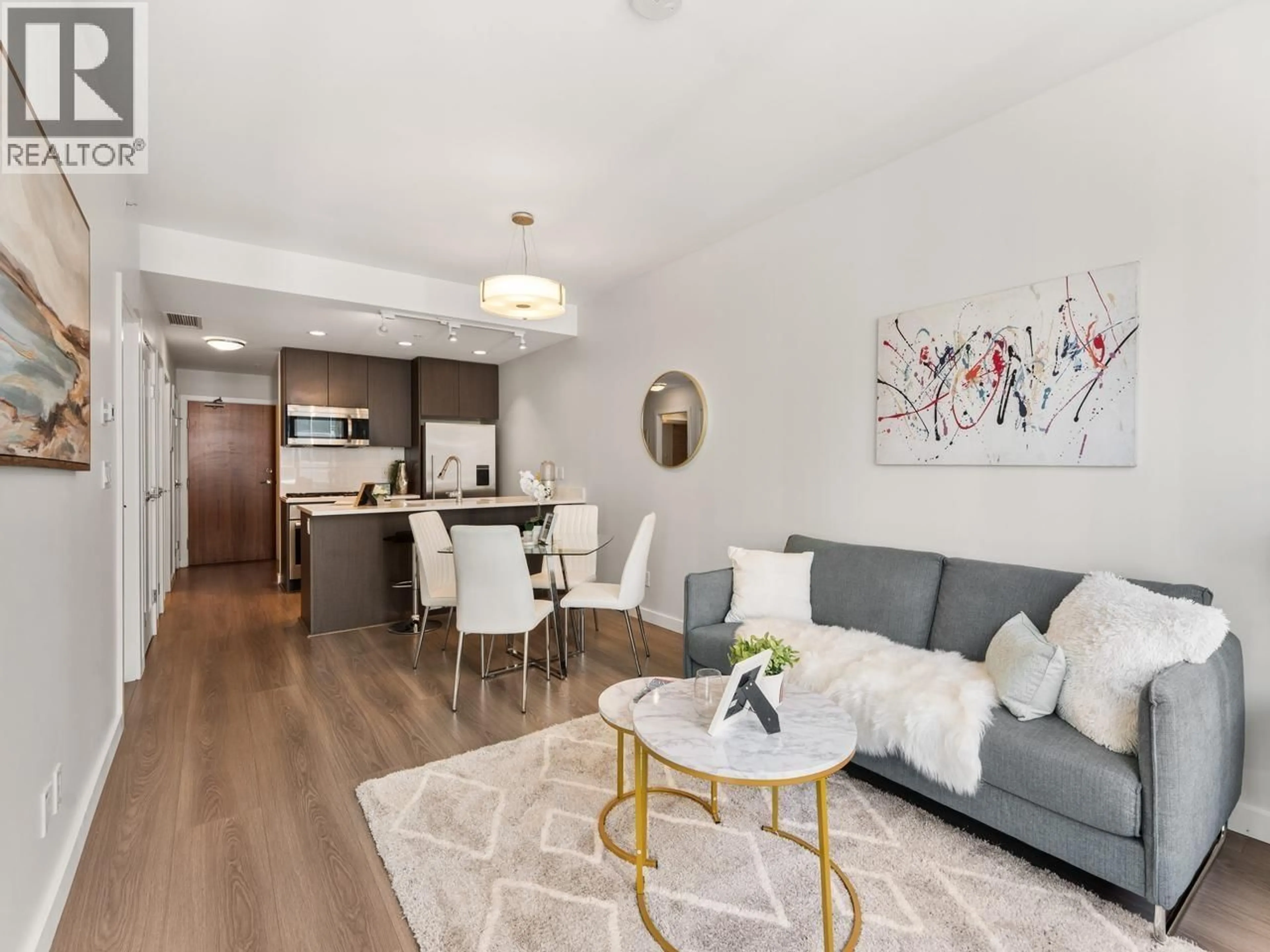 Living room with furniture, wood/laminate floor for 711 - 8628 HAZELBRIDGE WAY, Richmond British Columbia V6X0R5