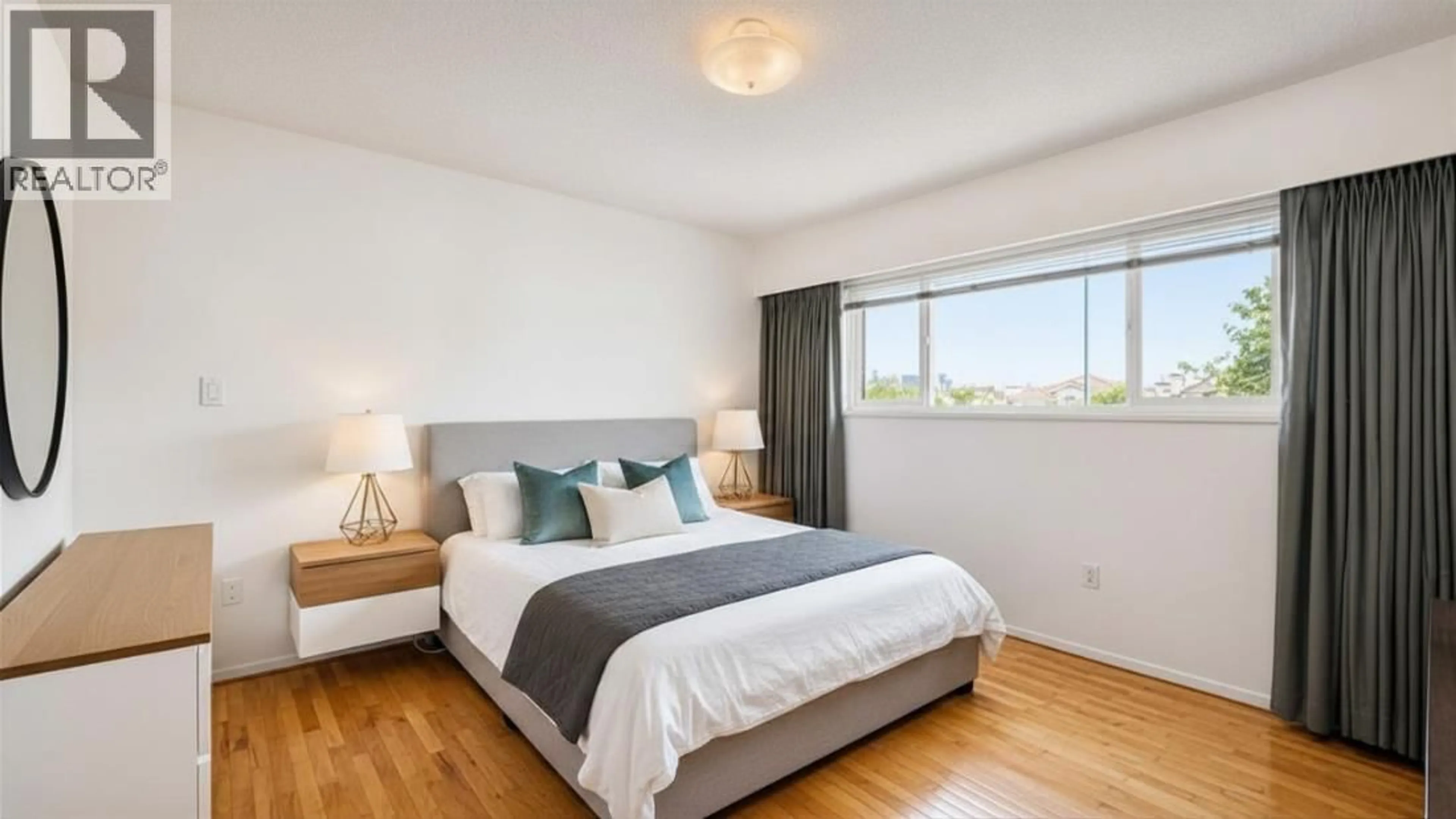 Bedroom with bed, wood/laminate floor for 3449 RUPERT STREET, Vancouver British Columbia V5M3V8