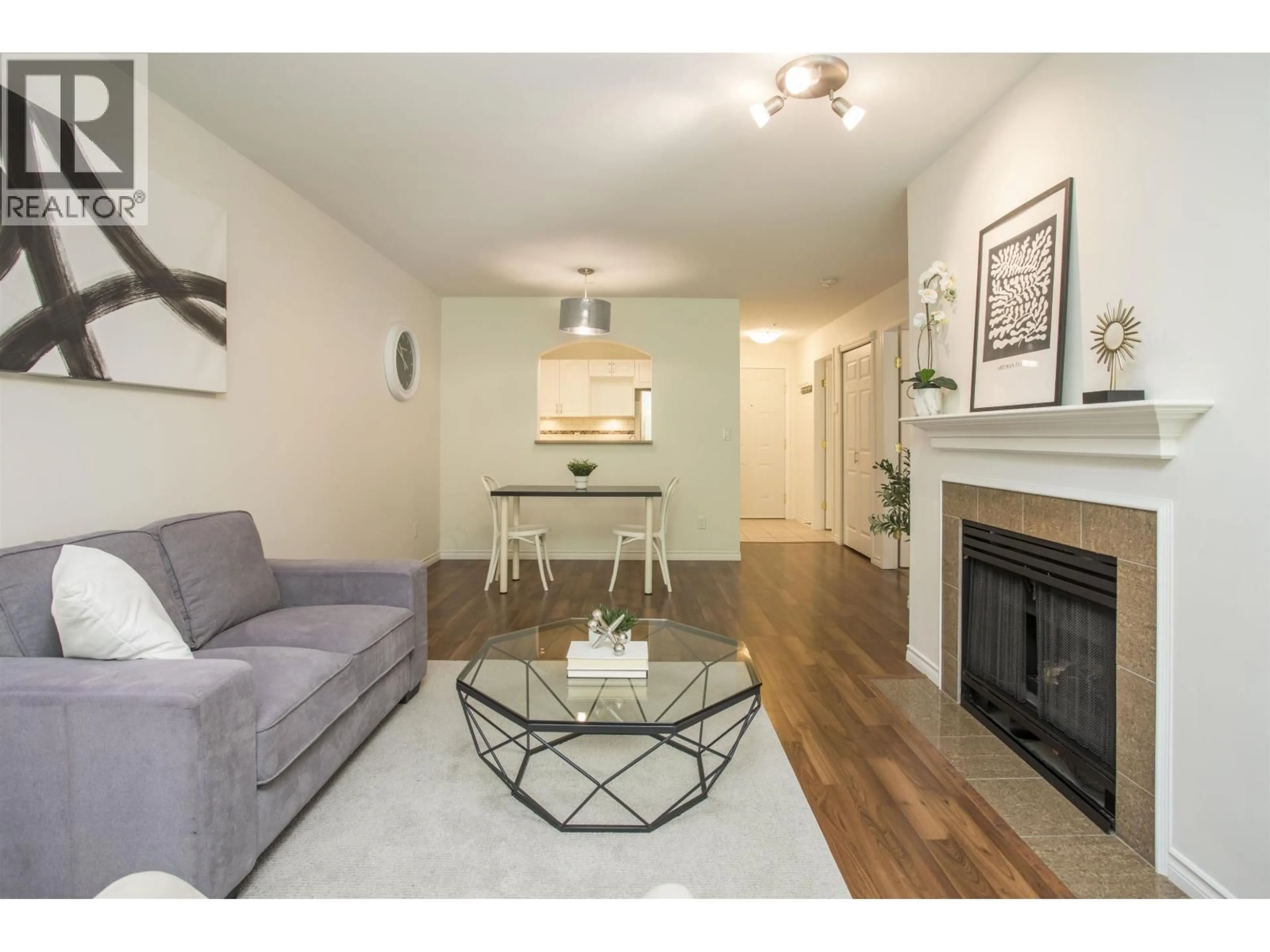 Living room with furniture, wood/laminate floor for 144 - 2980 PRINCESS CRESCENT, Coquitlam British Columbia V3B7R4