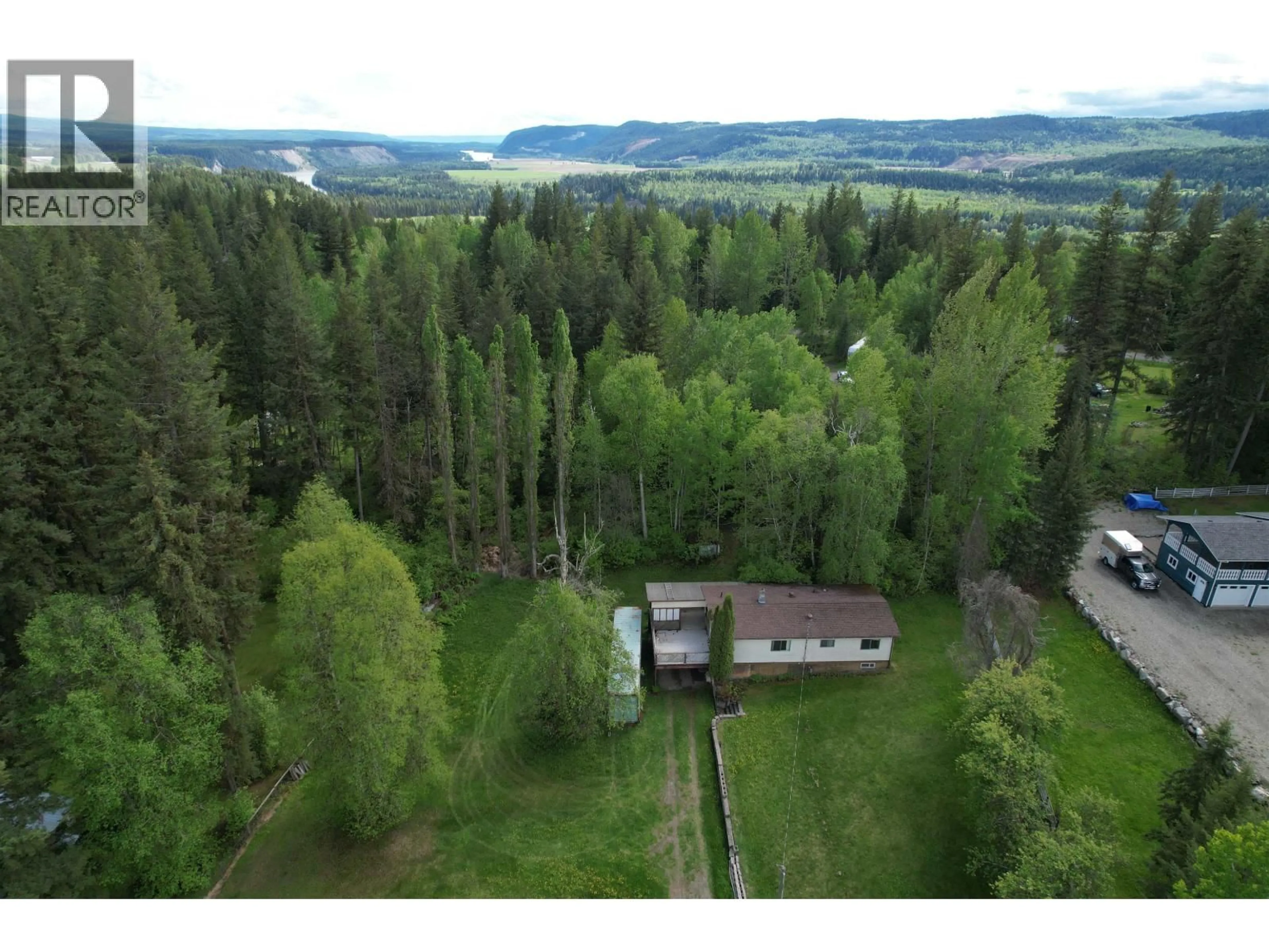 A pic from outside/outdoor area/front of a property/back of a property/a pic from drone, forest/trees view for 3813 LOLOFF CRESCENT, Quesnel British Columbia V2J6E3