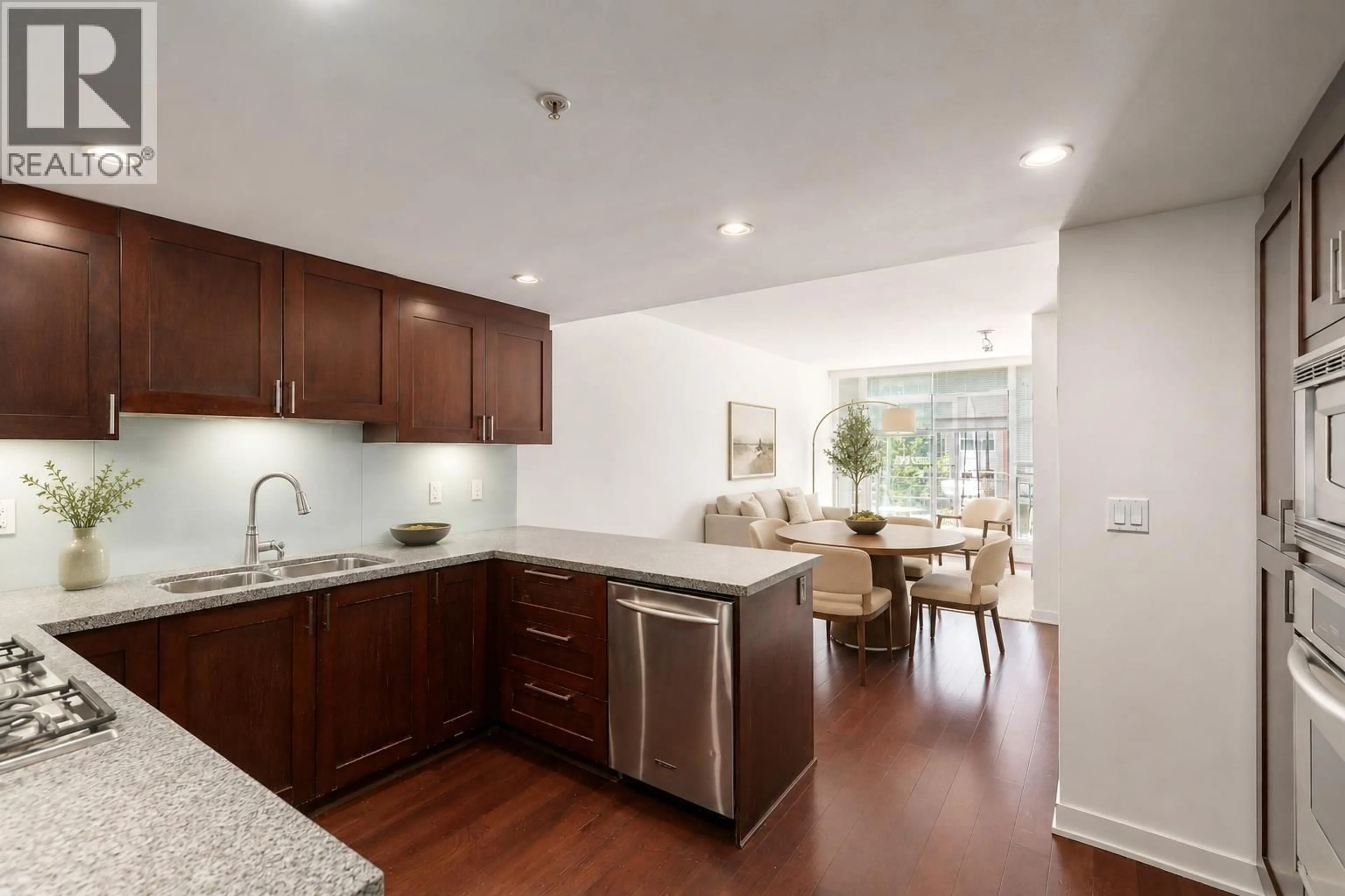 Open concept kitchen, wood/laminate floor for 303 - 3595 18TH AVENUE, Vancouver British Columbia V6S1A9