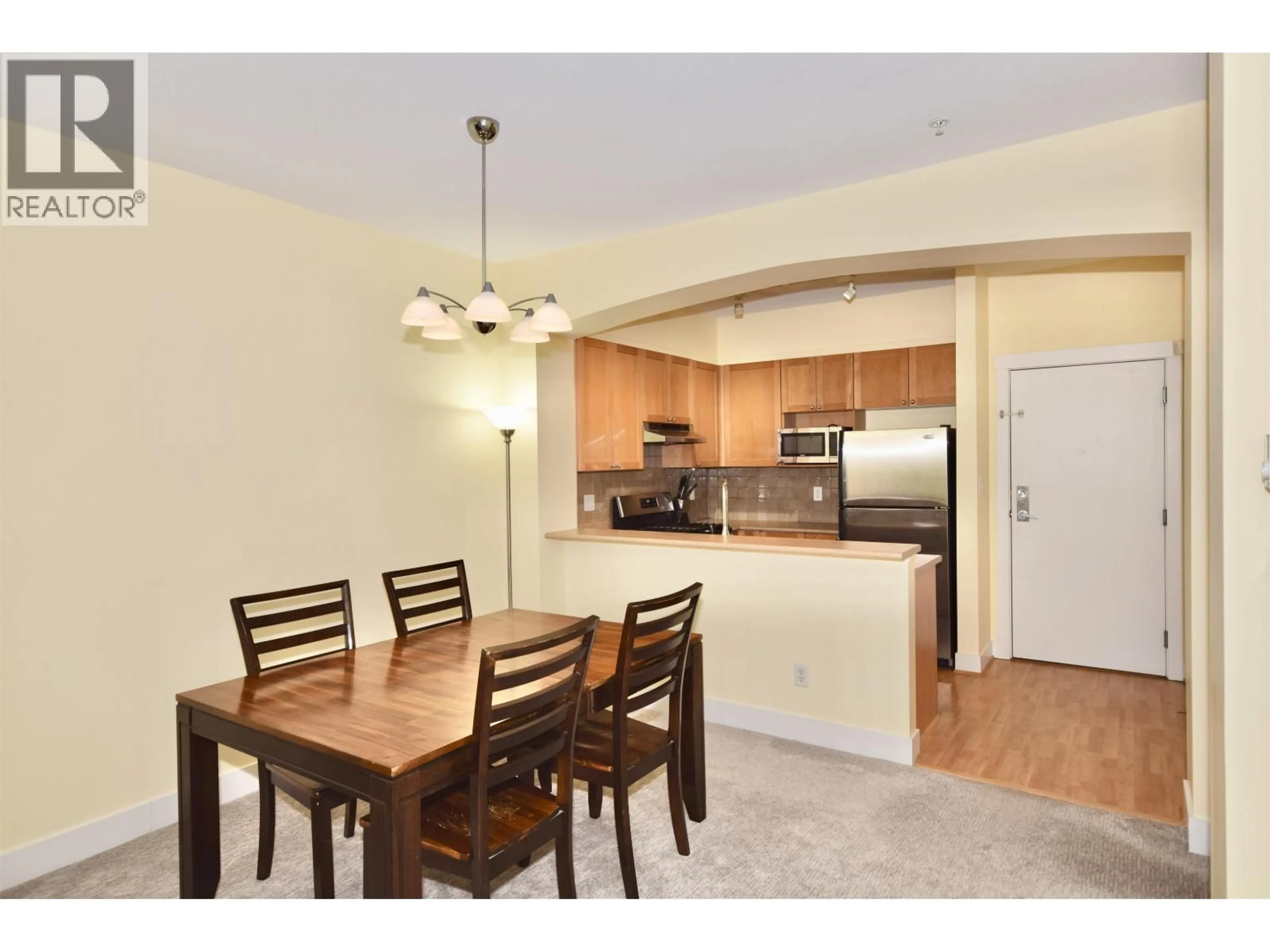 Open concept kitchen, wood/laminate floor for 308 - 2280 WESBROOK MALL, Vancouver British Columbia V6T2K3