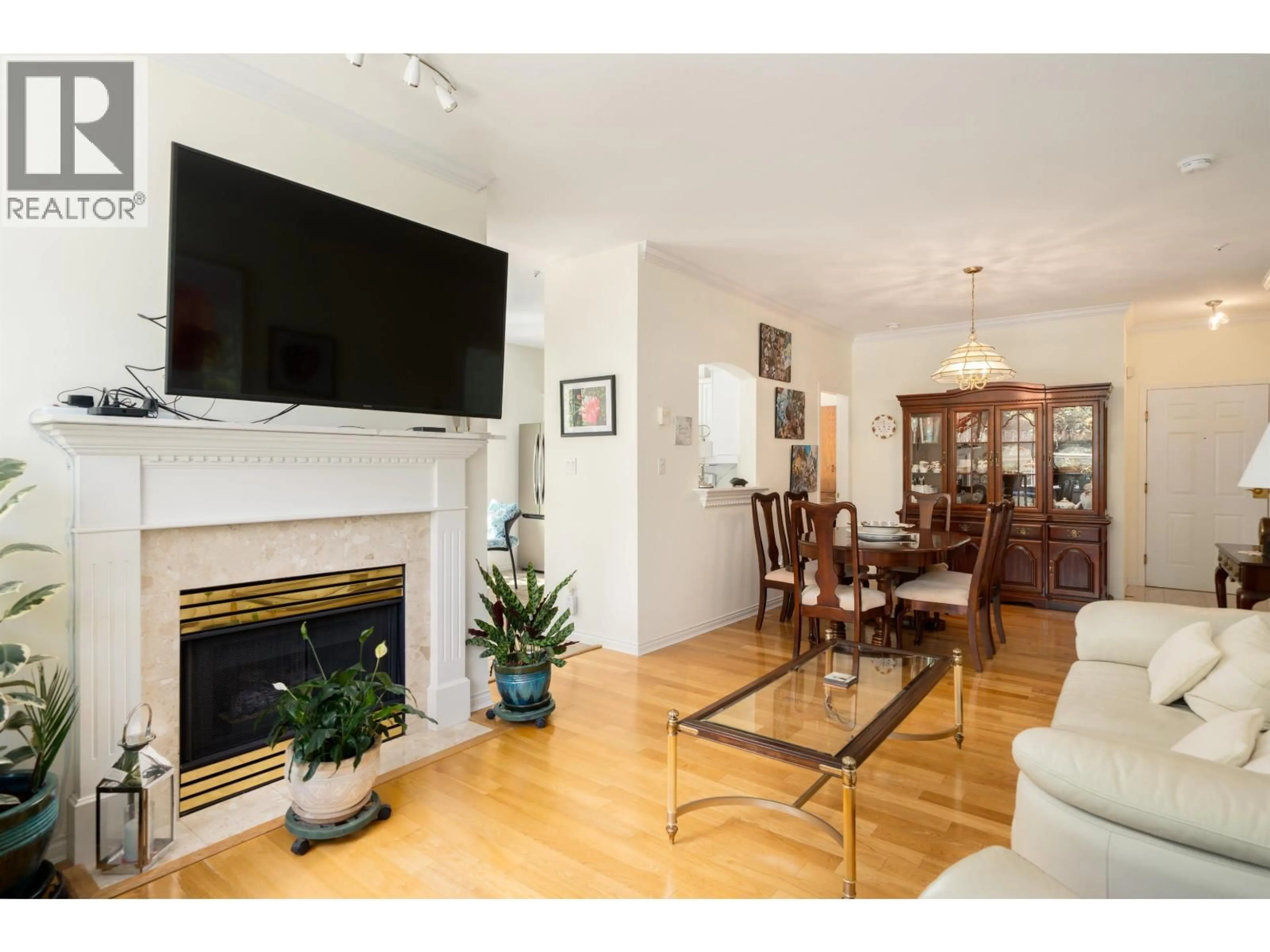 Living room with furniture, wood/laminate floor for 229 - 3098 GUILDFORD WAY, Coquitlam British Columbia V3B7W8