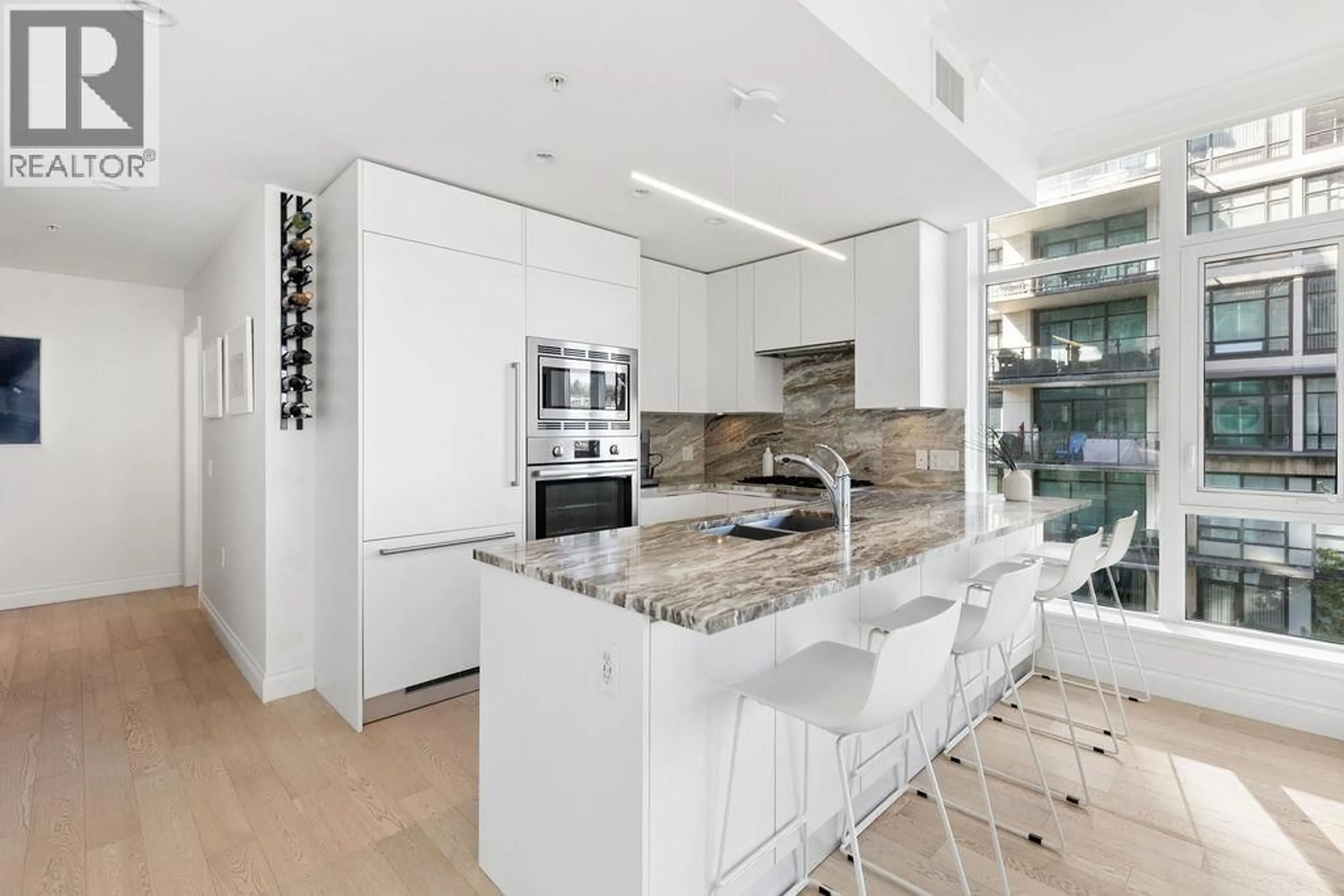 Contemporary kitchen, ceramic/tile floor for 409 - 185 VICTORY SHIP WAY, North Vancouver British Columbia V7L0G2