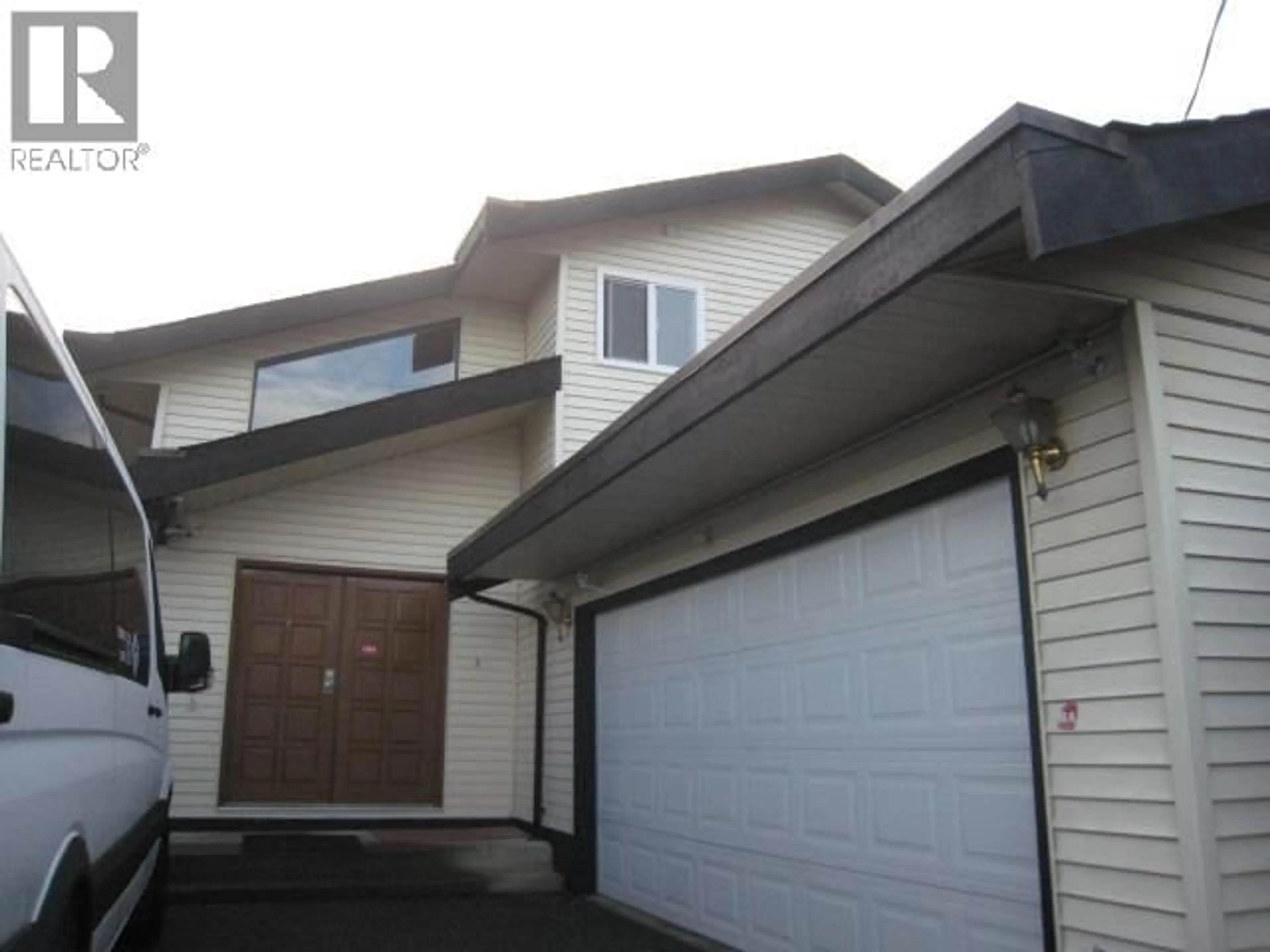 Home with vinyl exterior material, street for 7868 ELWELL STREET, Burnaby British Columbia V5E1M2