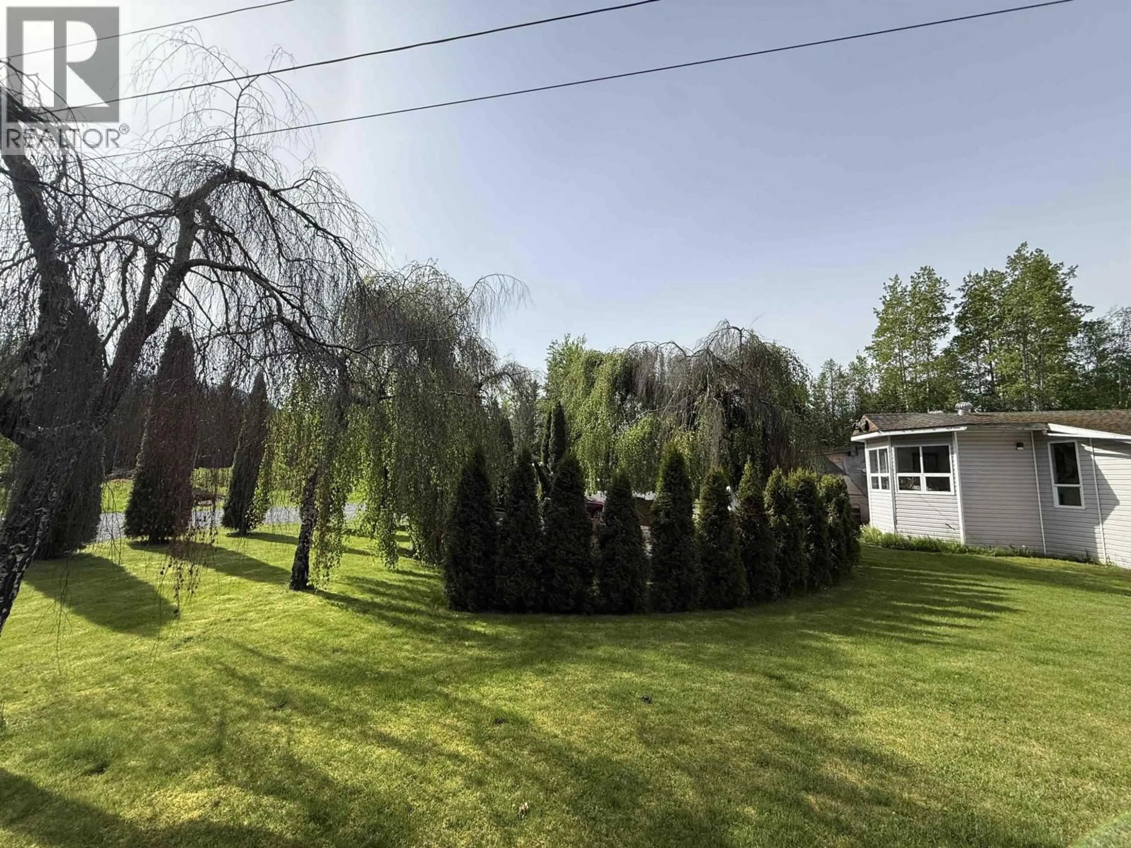 A pic from outside/outdoor area/front of a property/back of a property/a pic from drone, forest/trees view for 3679 KRUMM AVENUE, Thornhill British Columbia V8G4Y2
