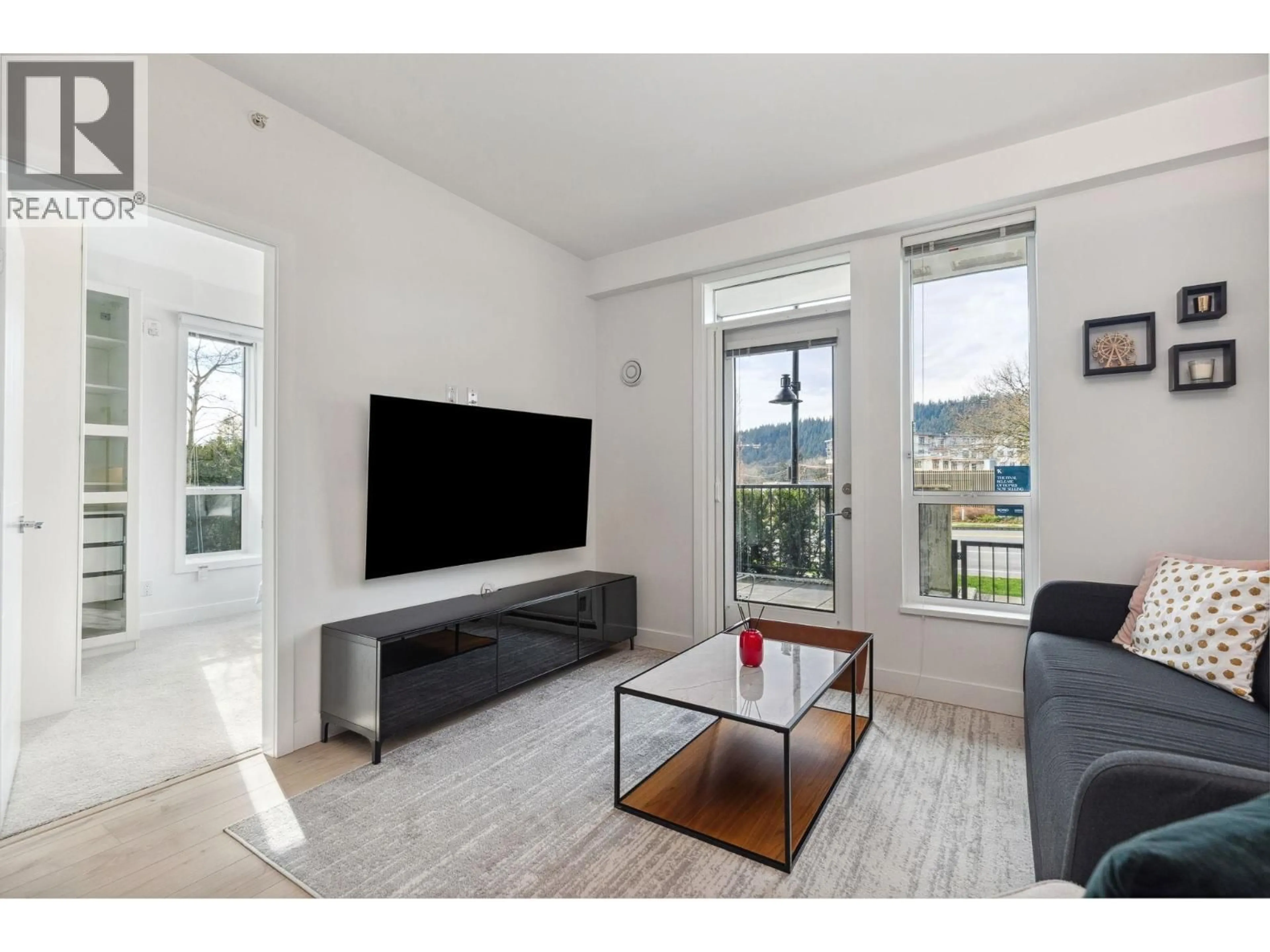 Living room with furniture, unknown for 101 - 700 CLARKE ROAD, Coquitlam British Columbia V3J3Y1