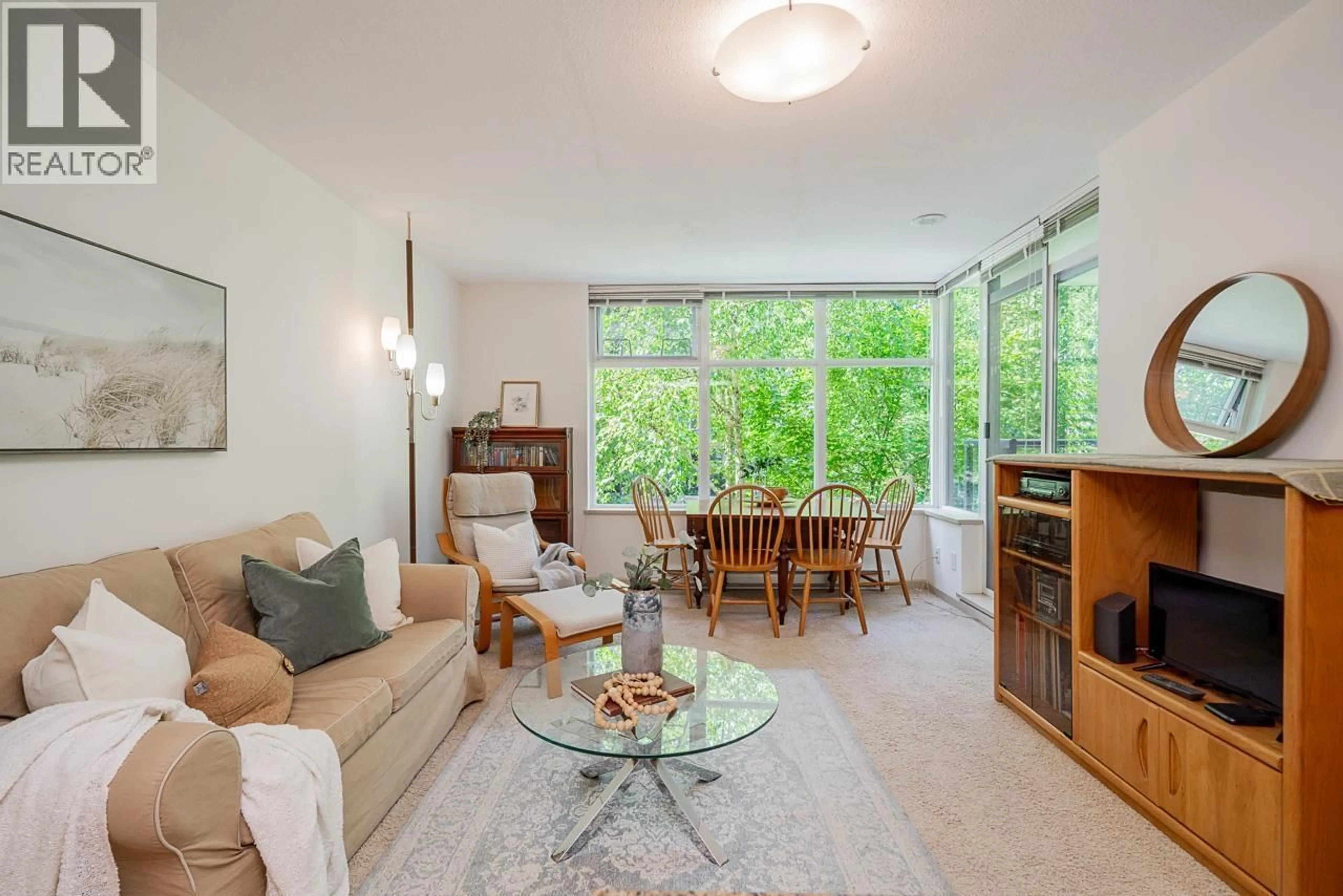 Living room with furniture, unknown for 204 - 9262 UNIVERSITY CRESCENT, Burnaby British Columbia V5A0A4