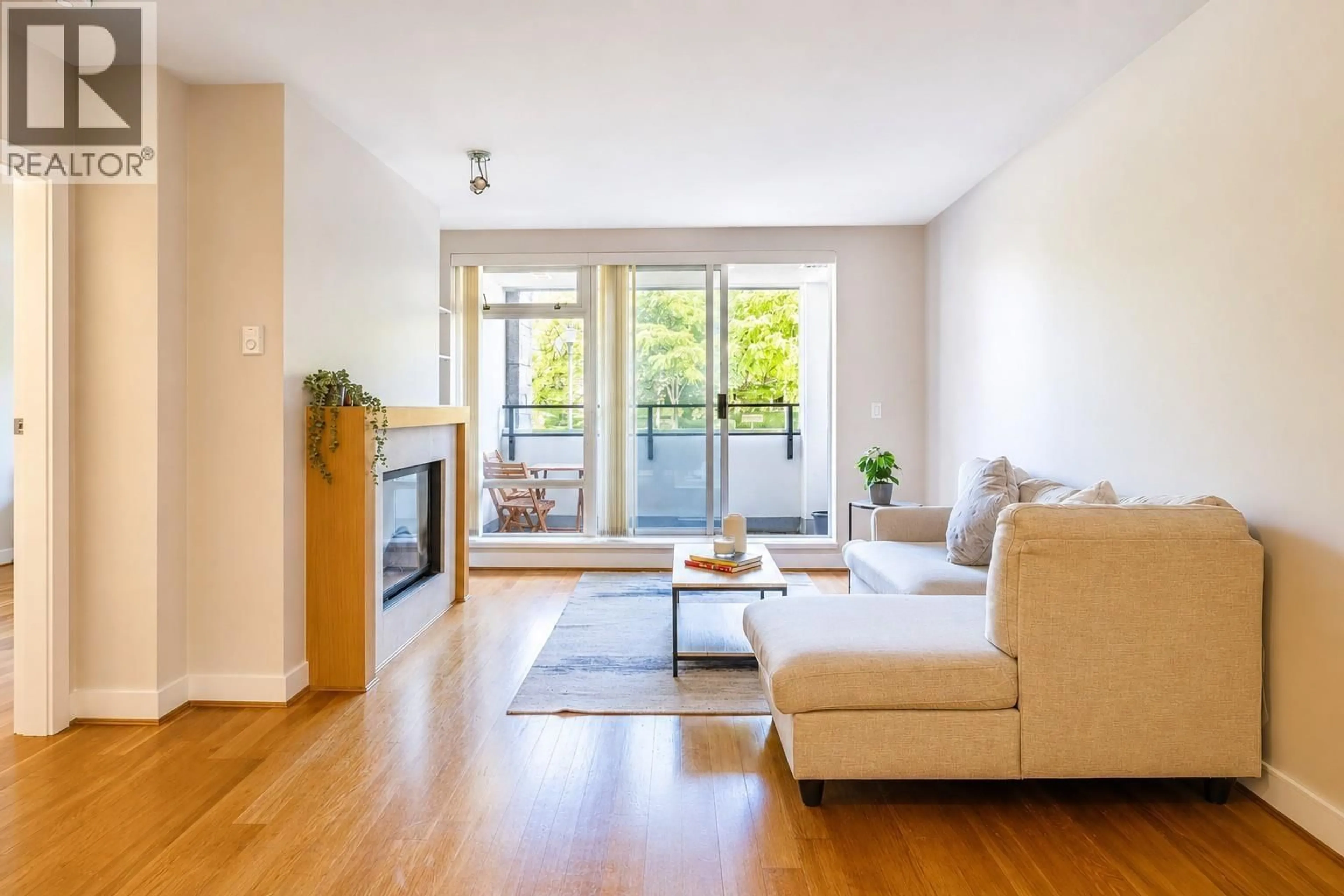 Living room with furniture, wood/laminate floor for 107 - 6015 IONA DRIVE, Vancouver British Columbia V6T2J4