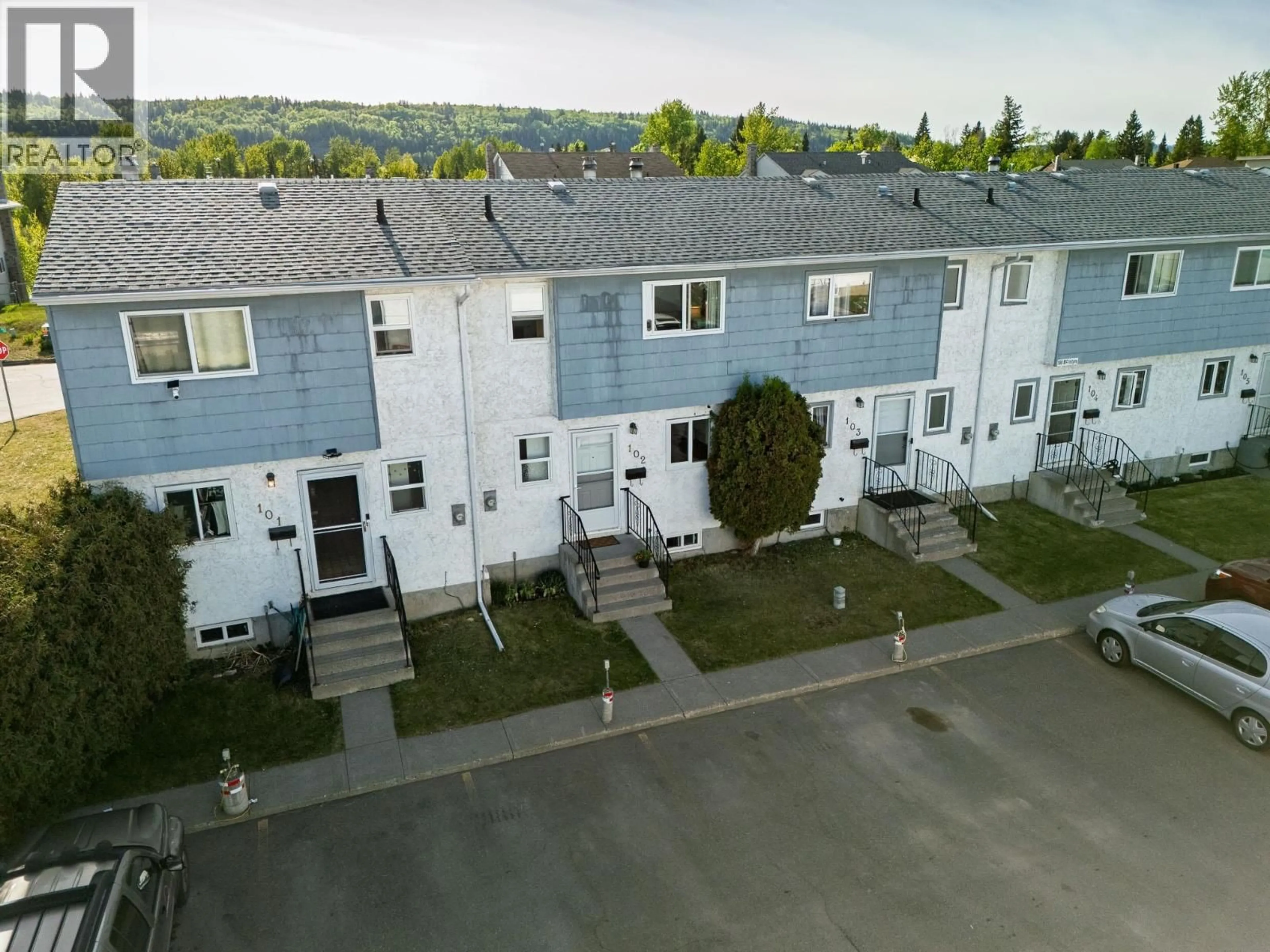 A pic from outside/outdoor area/front of a property/back of a property/a pic from drone, street for 102 - 190 MCINTYRE CRESCENT, Prince George British Columbia V2M6A8