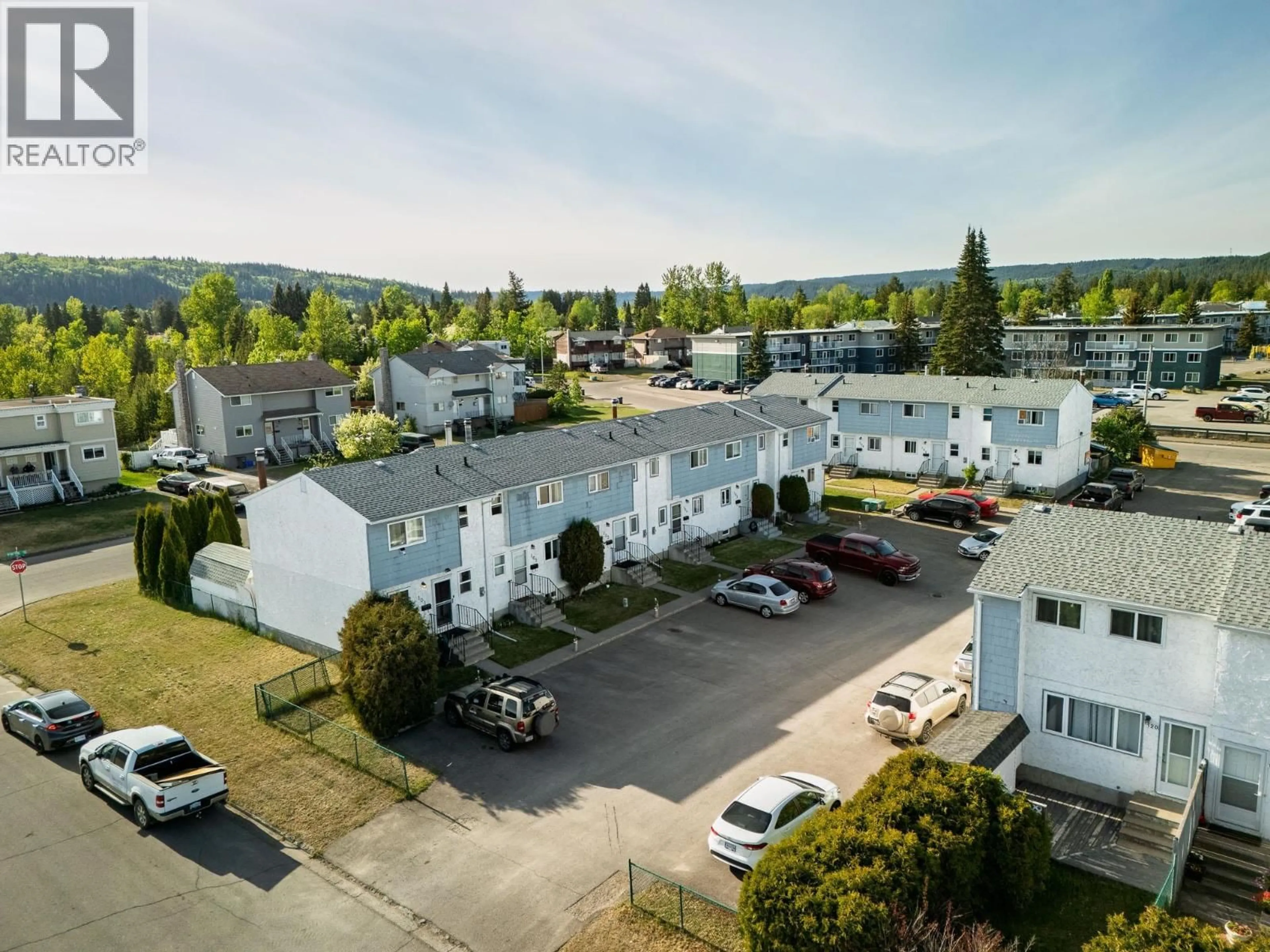 A pic from outside/outdoor area/front of a property/back of a property/a pic from drone, mountain view for 102 - 190 MCINTYRE CRESCENT, Prince George British Columbia V2M6A8