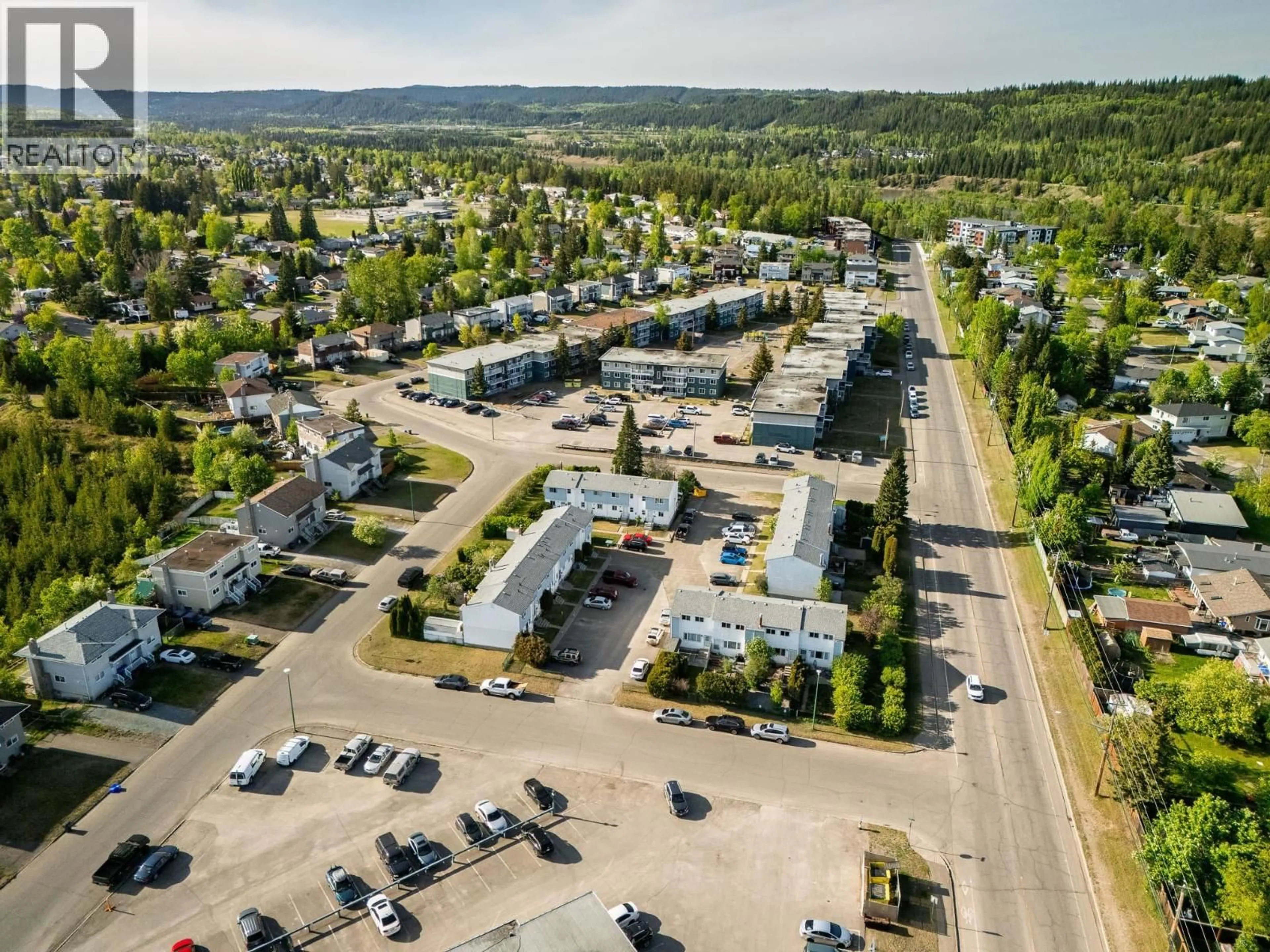 A pic from outside/outdoor area/front of a property/back of a property/a pic from drone, street for 102 - 190 MCINTYRE CRESCENT, Prince George British Columbia V2M6A8