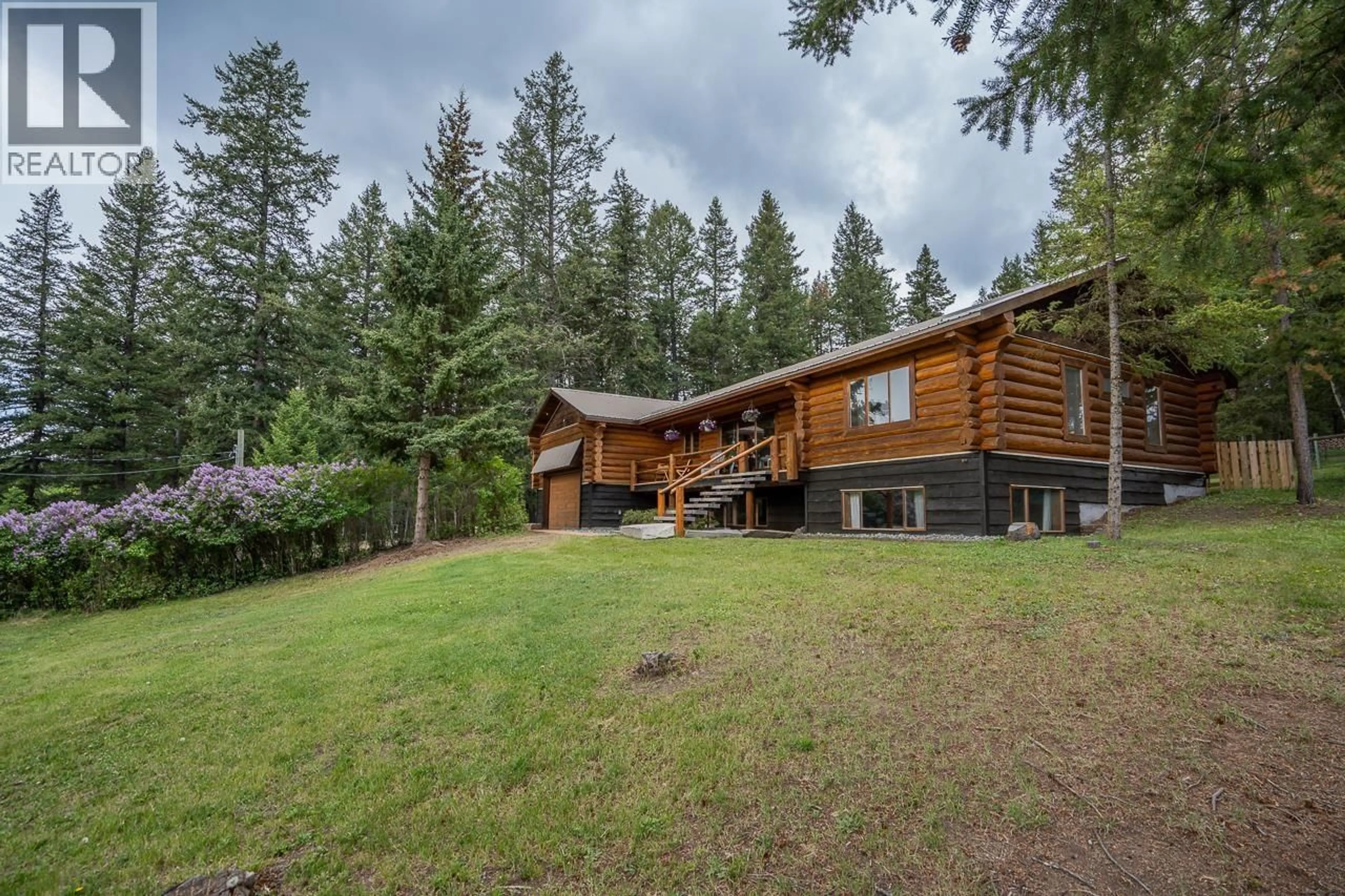 A pic from outside/outdoor area/front of a property/back of a property/a pic from drone, forest/trees view for 5172 KALLUM DRIVE, 108 Mile Ranch British Columbia V0K2Z0