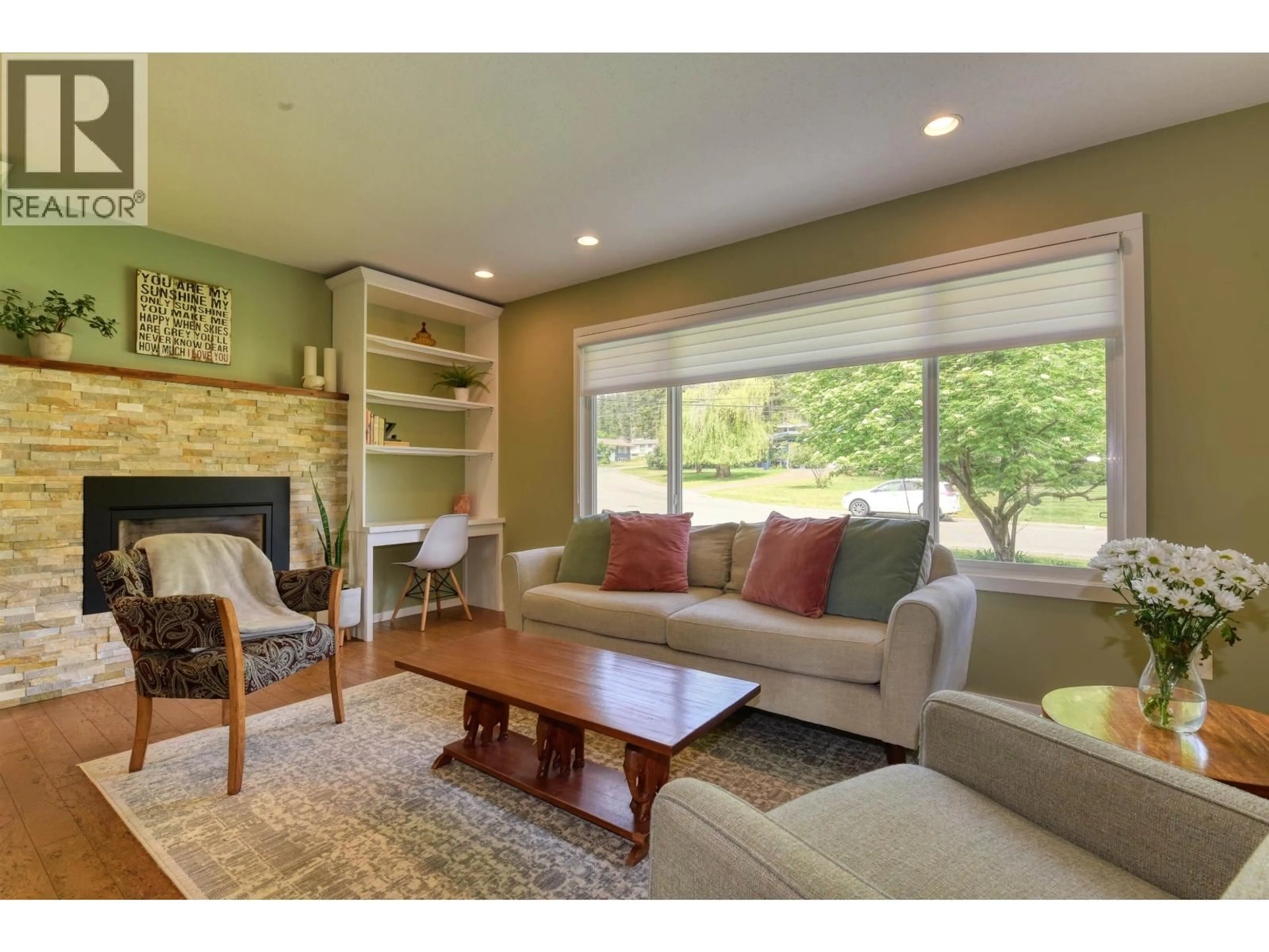 Living room with furniture, wood/laminate floor for 1125 PIGEON AVENUE, Williams Lake British Columbia V2G2C2