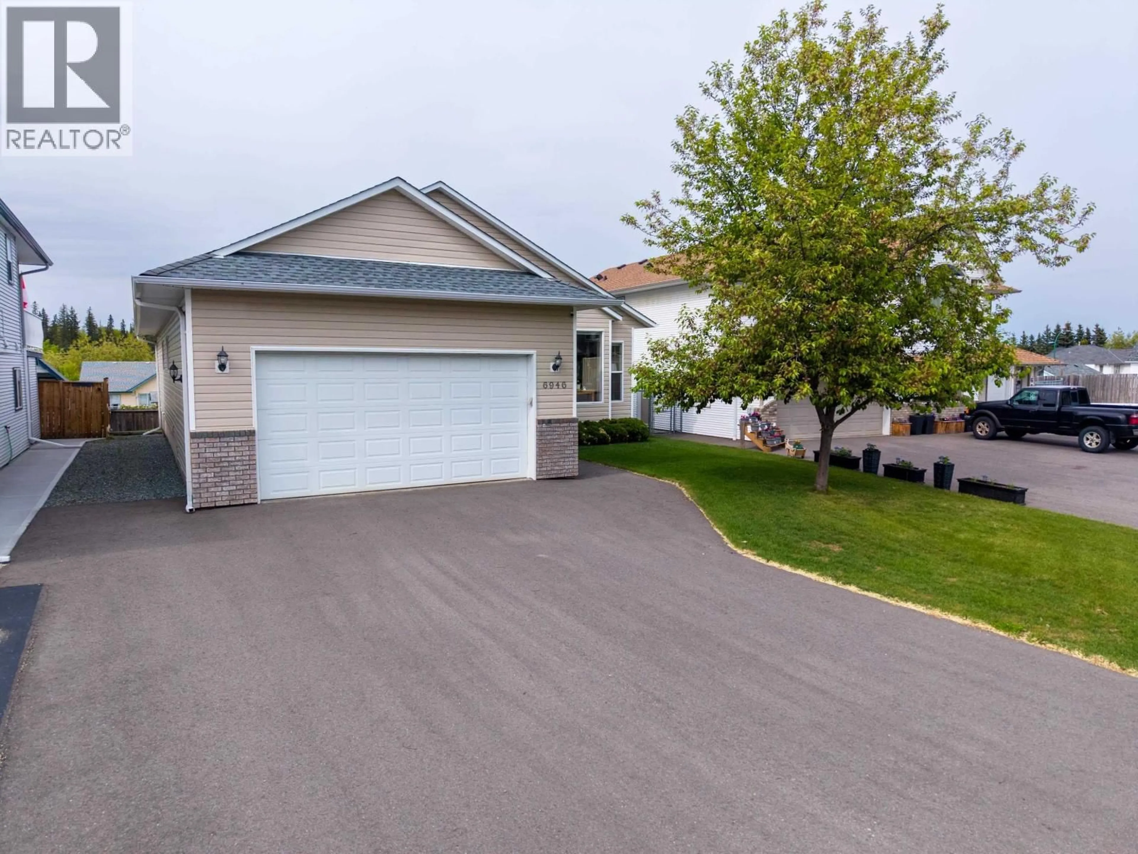 Home with vinyl exterior material, street for 6946 CHARTWELL CRESCENT, Prince George British Columbia V2N6Y4