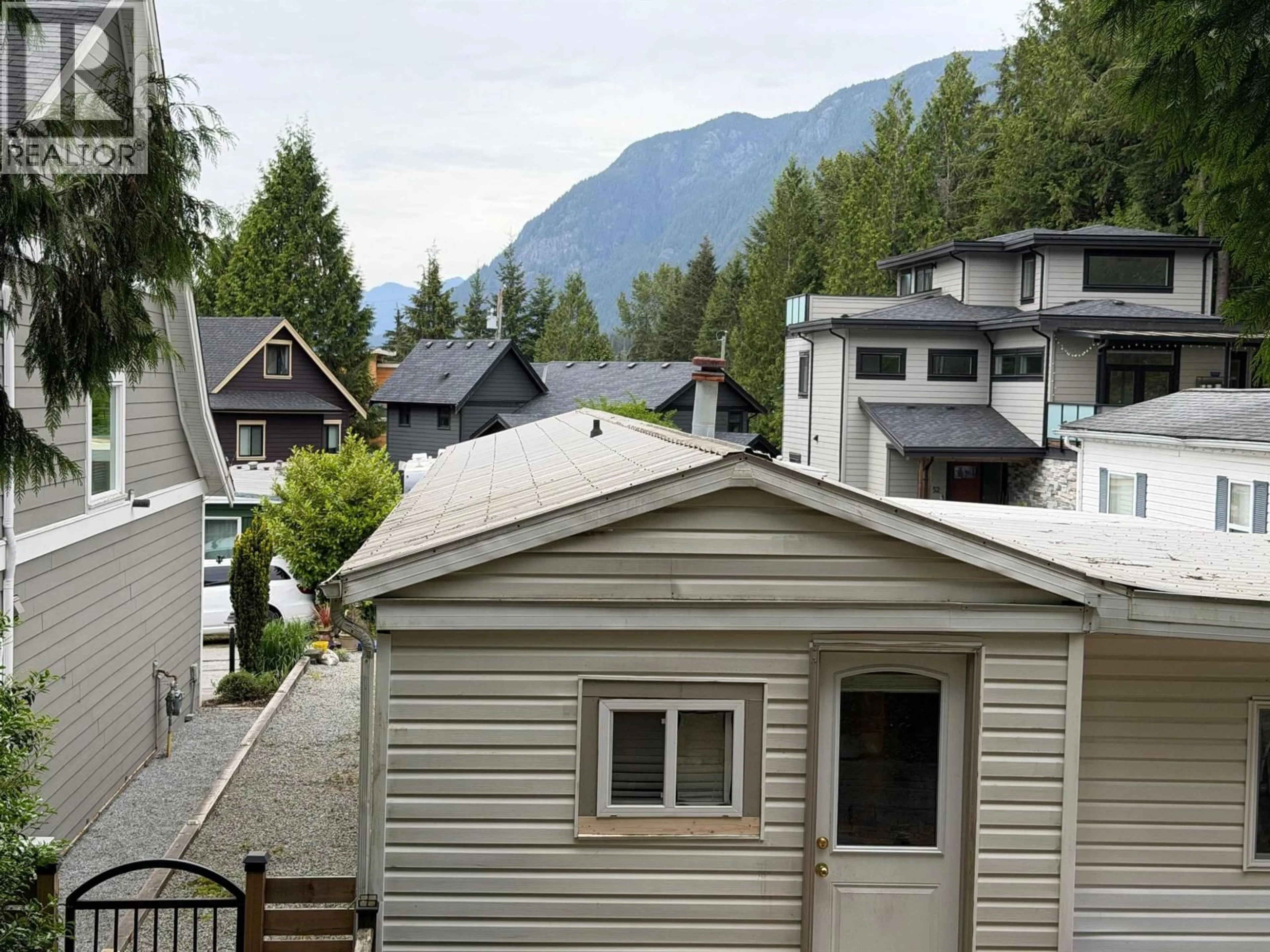 A pic from outside/outdoor area/front of a property/back of a property/a pic from drone, mountain view for 50 - 3295 SUNNYSIDE ROAD, Anmore British Columbia V3H4Z4