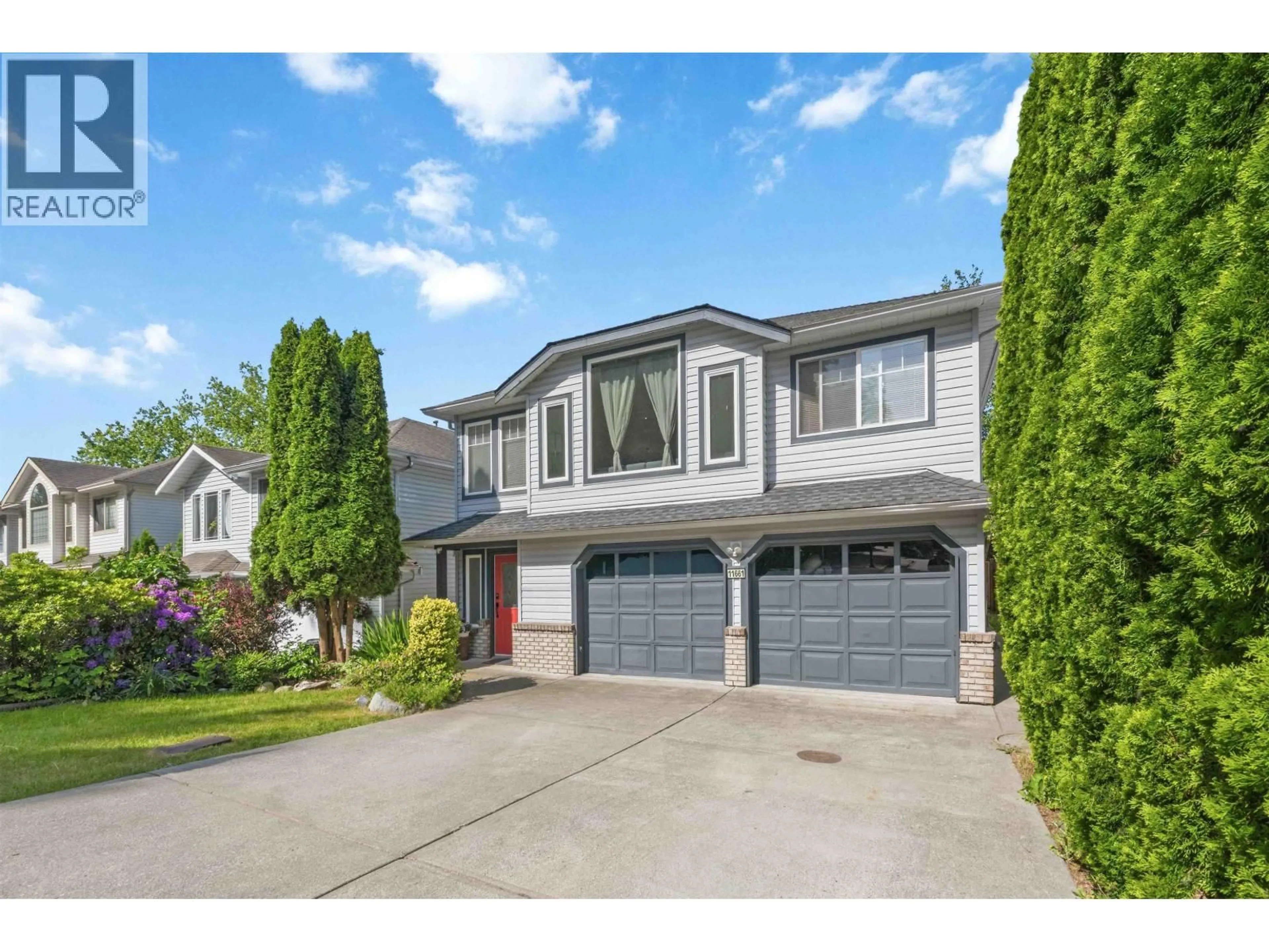 Home with vinyl exterior material, street for 11661 207 STREET, Maple Ridge British Columbia V2X1X2