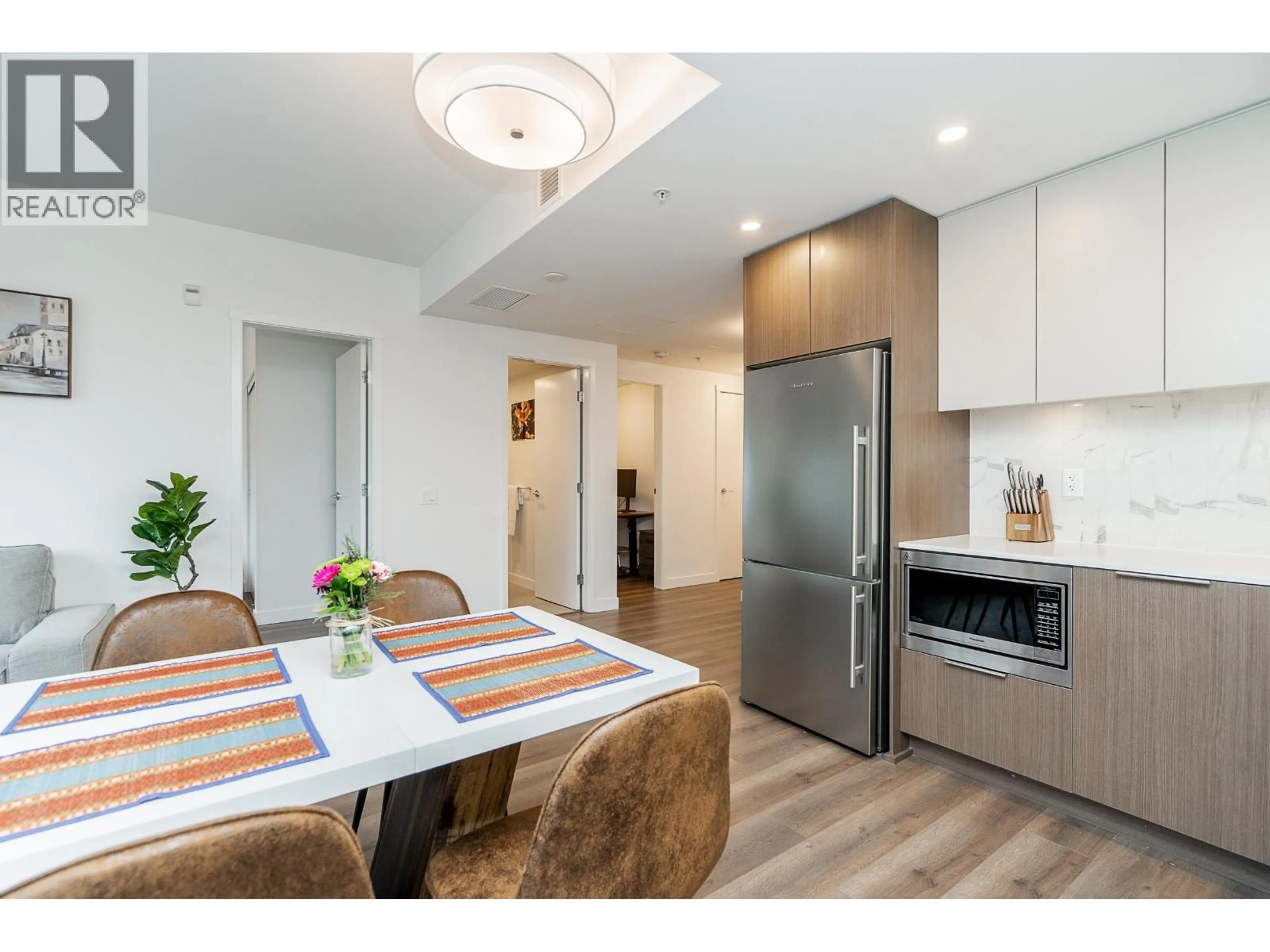 Open concept kitchen, wood/laminate floor for 304 - 645 COMO LAKE AVENUE, Coquitlam British Columbia V3J0N9