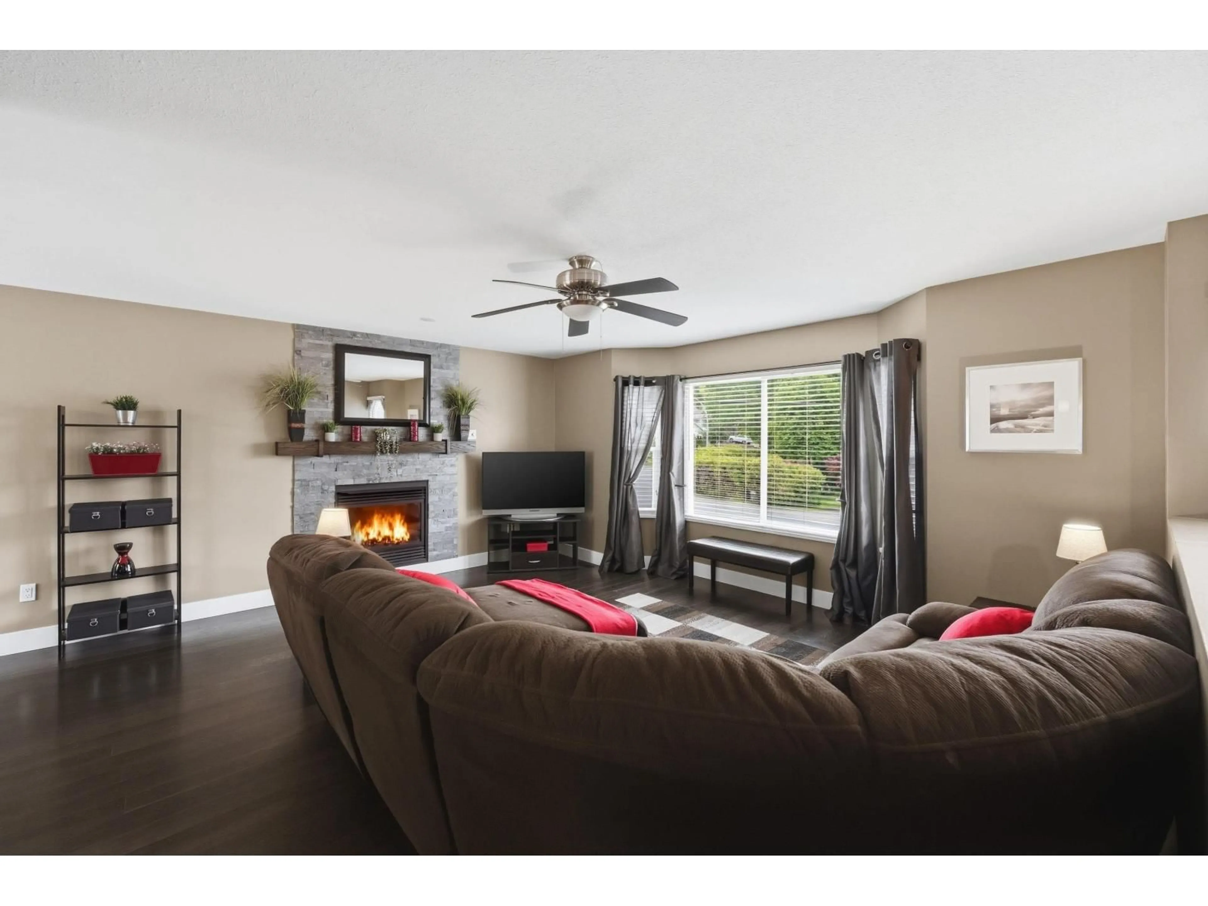 Living room with furniture, wood/laminate floor for 8912 213 STREET, Langley British Columbia V1M1Z3
