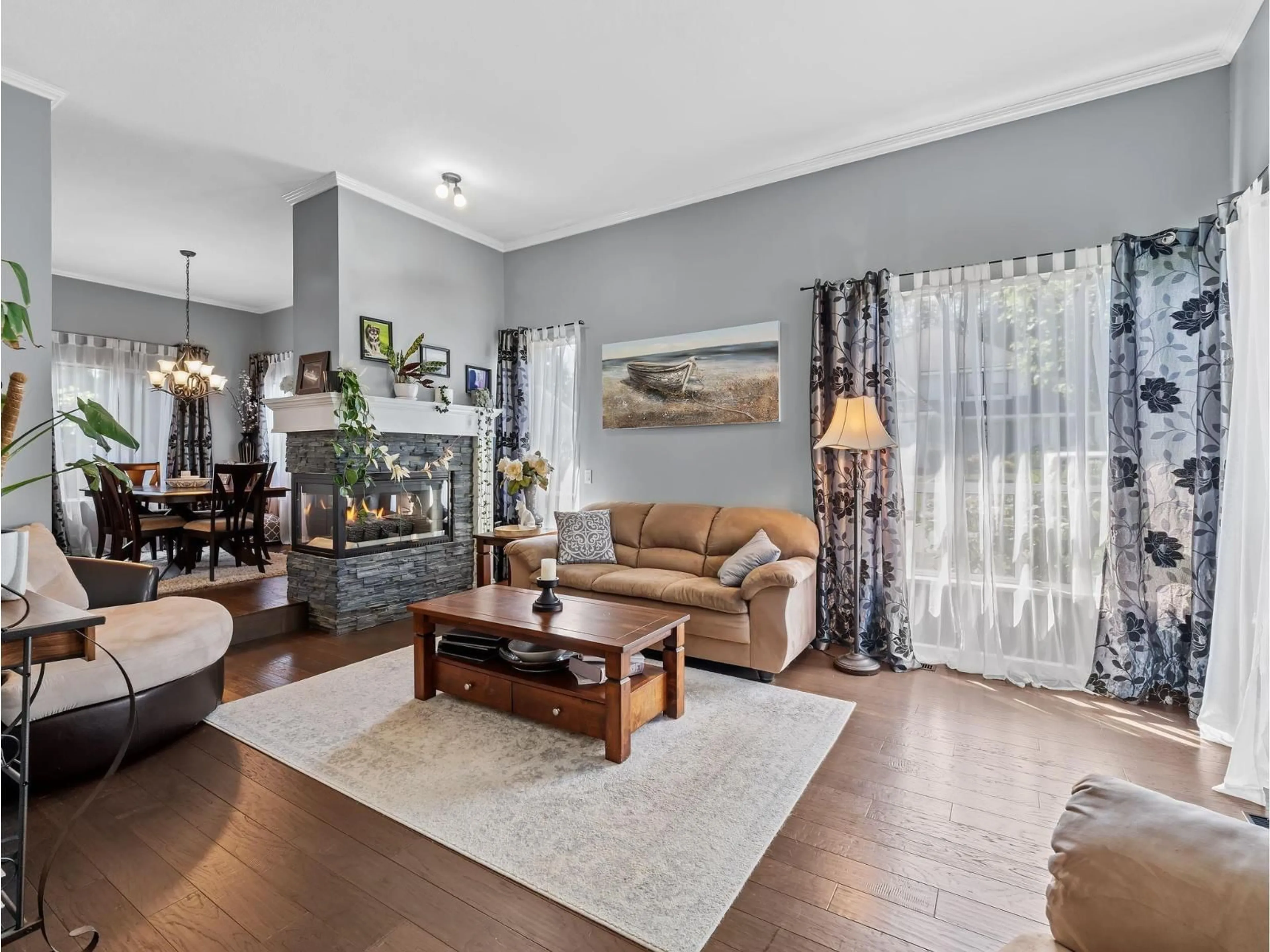 Living room with furniture, wood/laminate floor for 8672 163 STREET, Surrey British Columbia V4N1C7